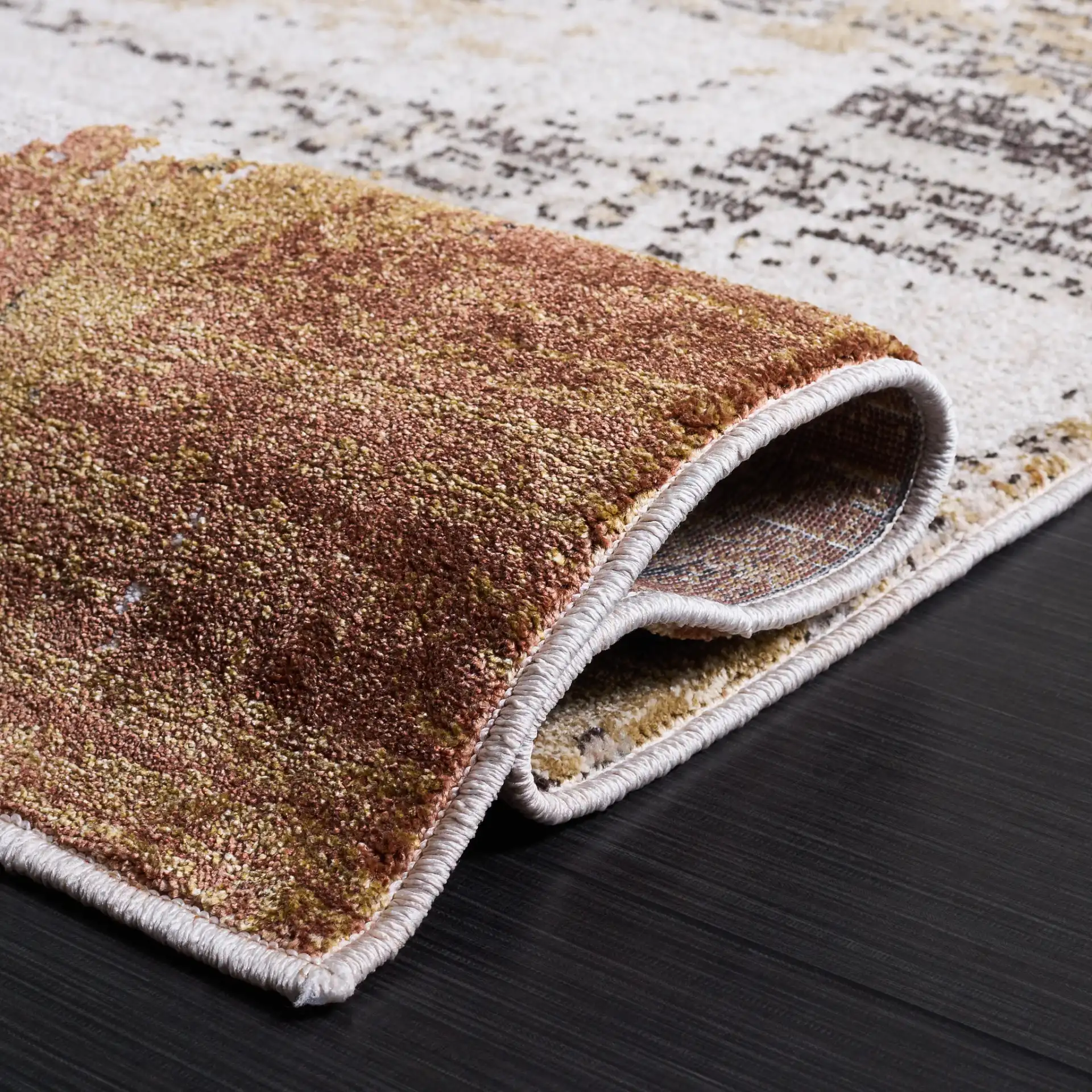 Marvel Abstract Brushstroke Rug in Dark Beige / Dark Gray in a styled room