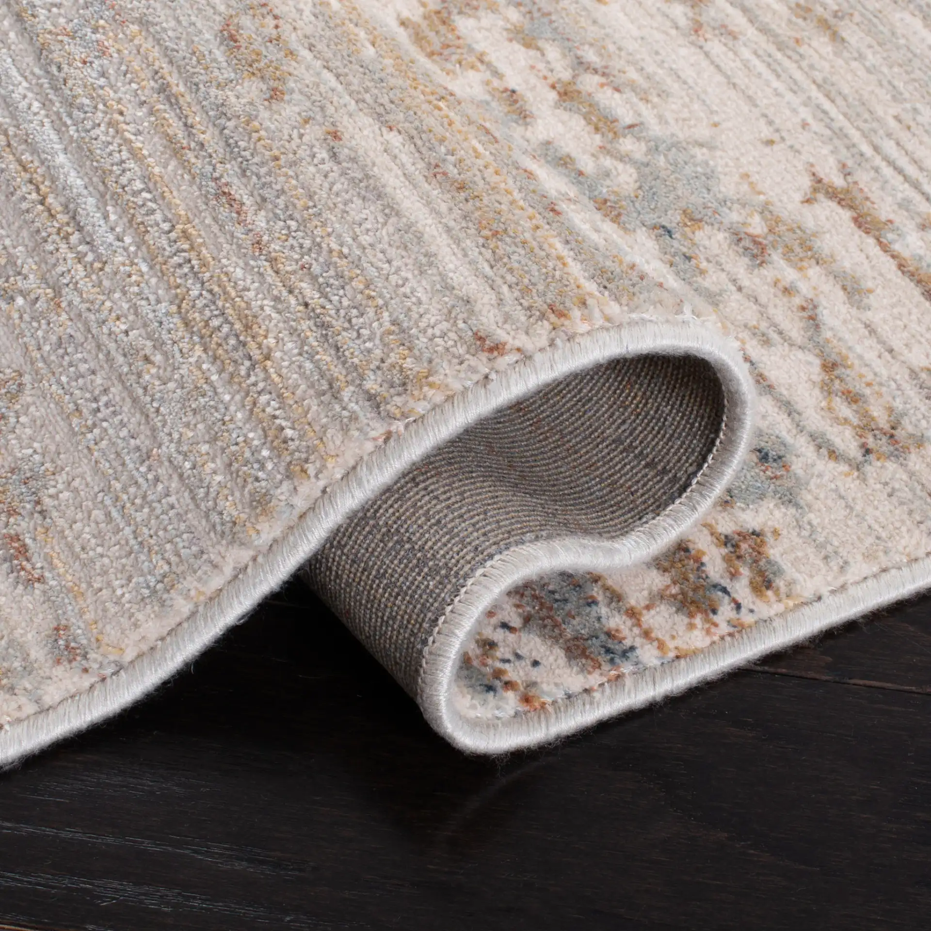 Marvel Striated Abstract Rug in Beige / Gold in a styled room