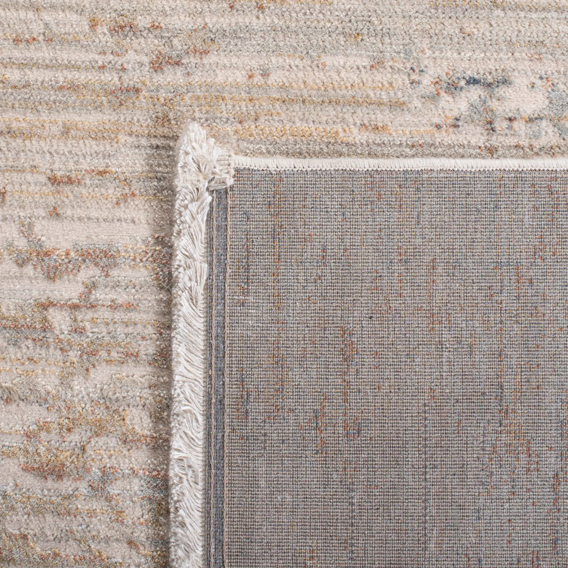 Marvel Striated Abstract Rug in Beige / Gold in a styled room