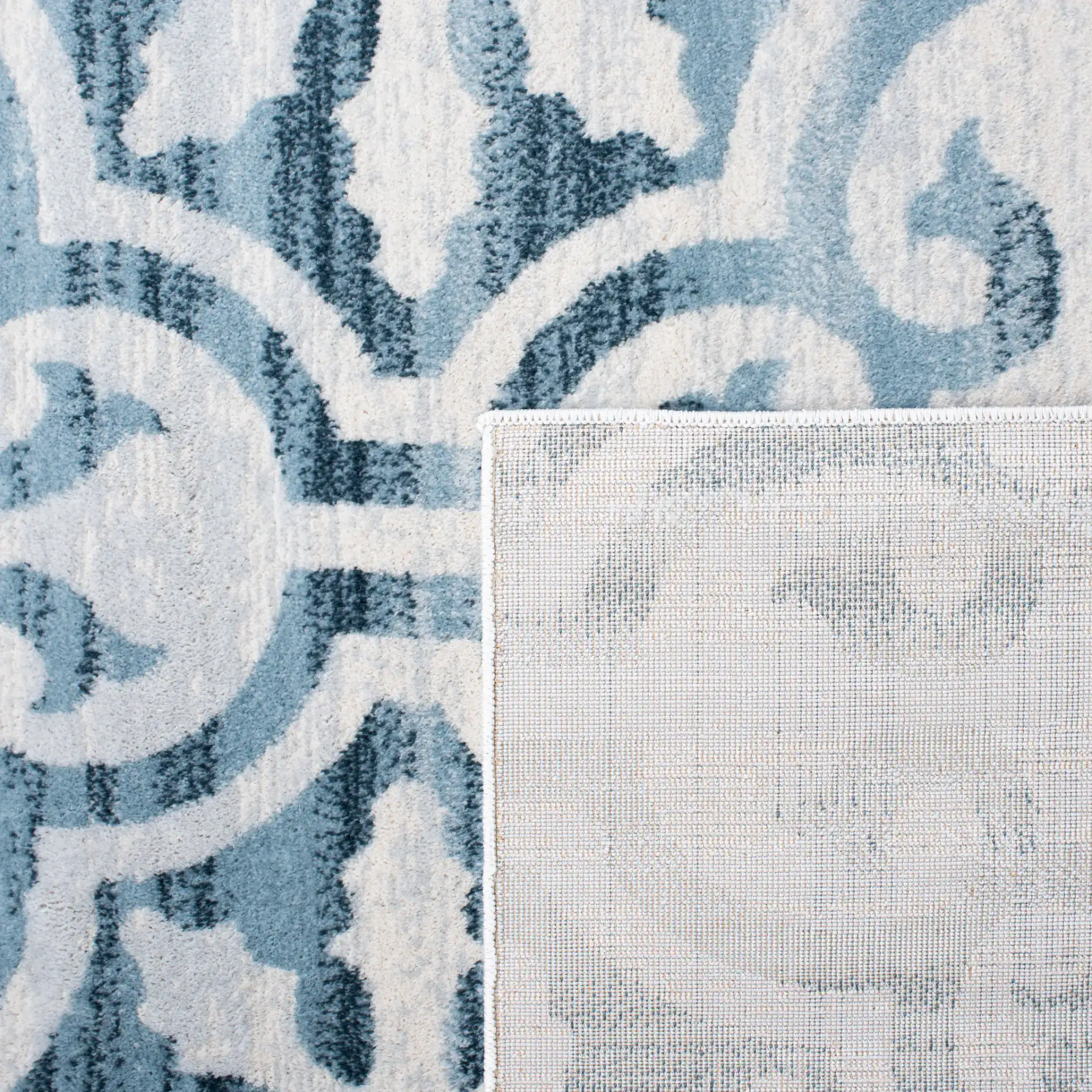 Martha Stewart Scroll Tile Rug in Navy / Ivory in a styled room