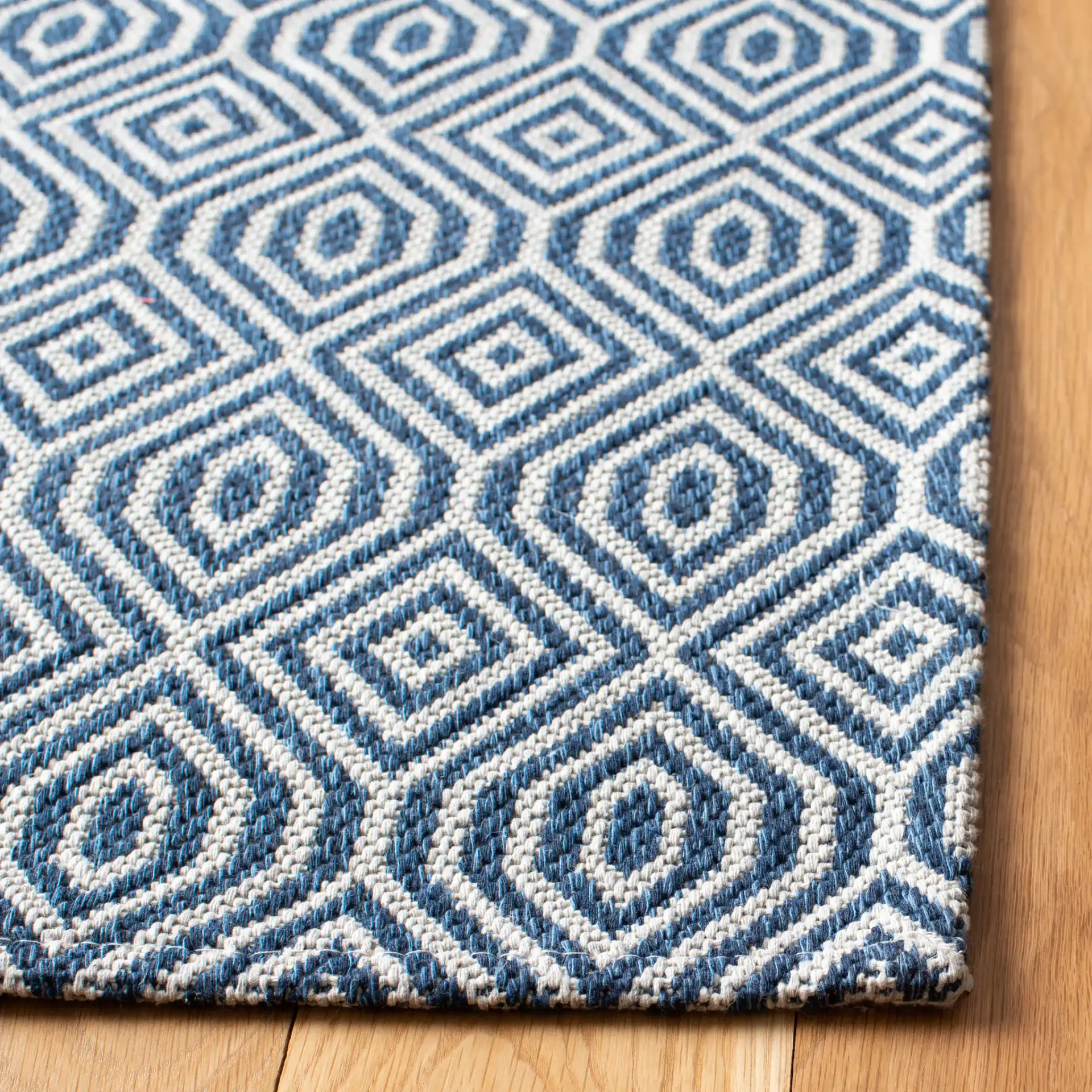Martha Stewart Concentric Diamond Cotton Rug in Martha Stewart Concentric Diamond Cotton Rug in a styled room