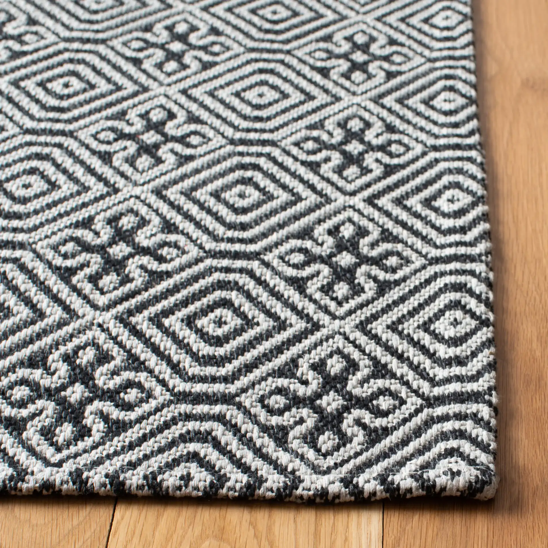 Martha Stewart Geometric Diamond Cotton Rug in Martha Stewart Geometric Diamond Cotton Rug in a styled room
