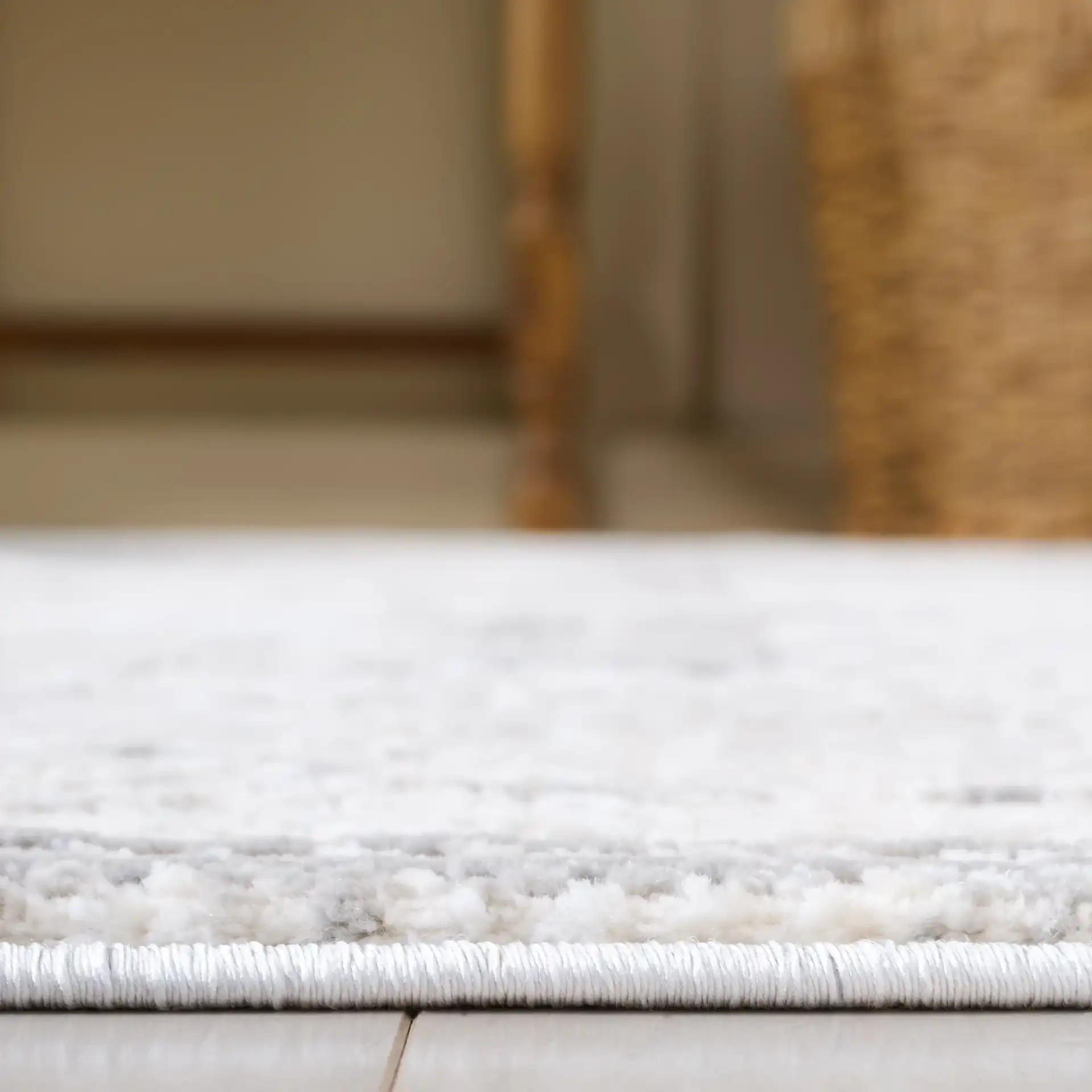 Martha Stewart Easton Distressed Medallion Rug in Ivory / Gray in a styled room