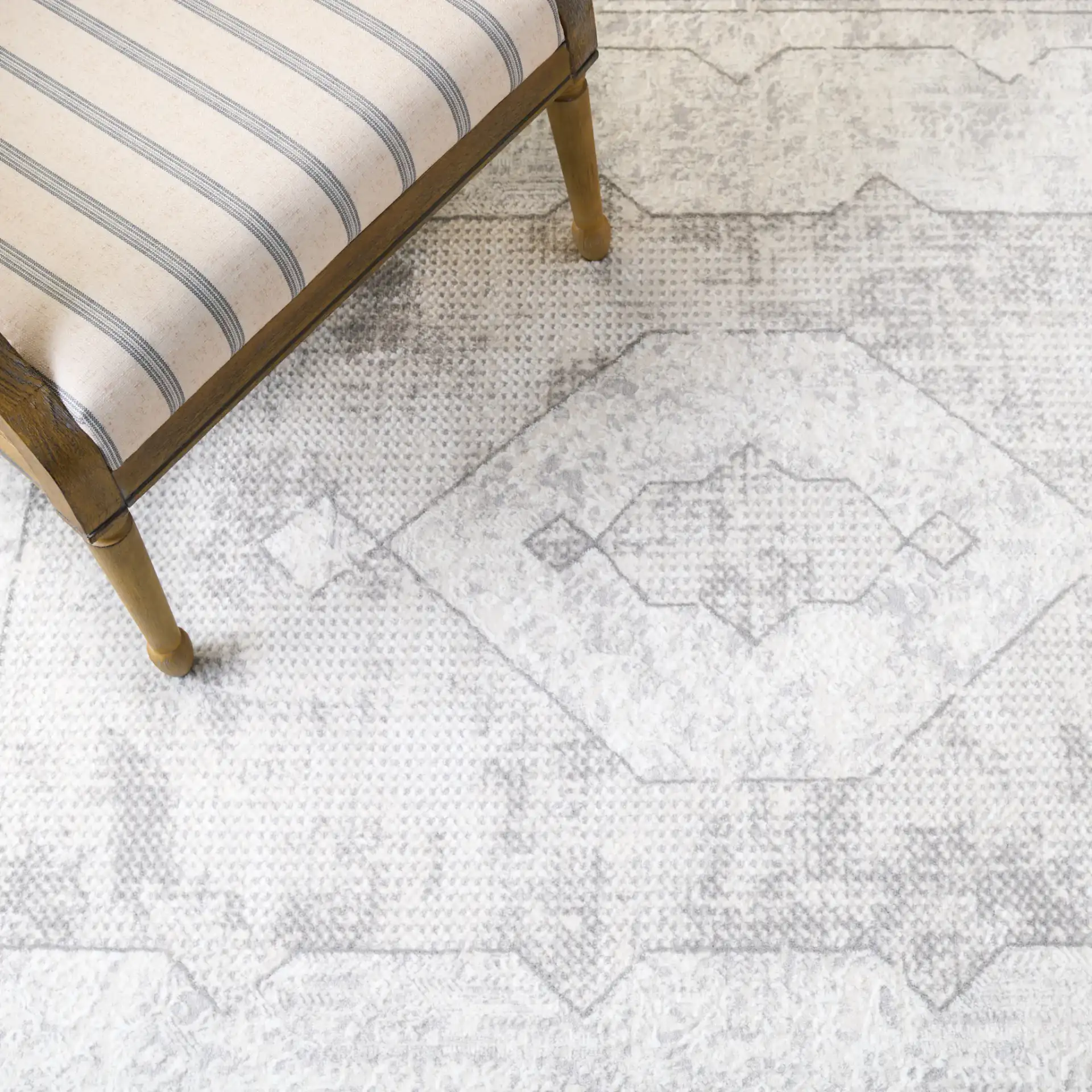 Martha Stewart Easton Distressed Medallion Rug in Ivory / Gray in a styled room