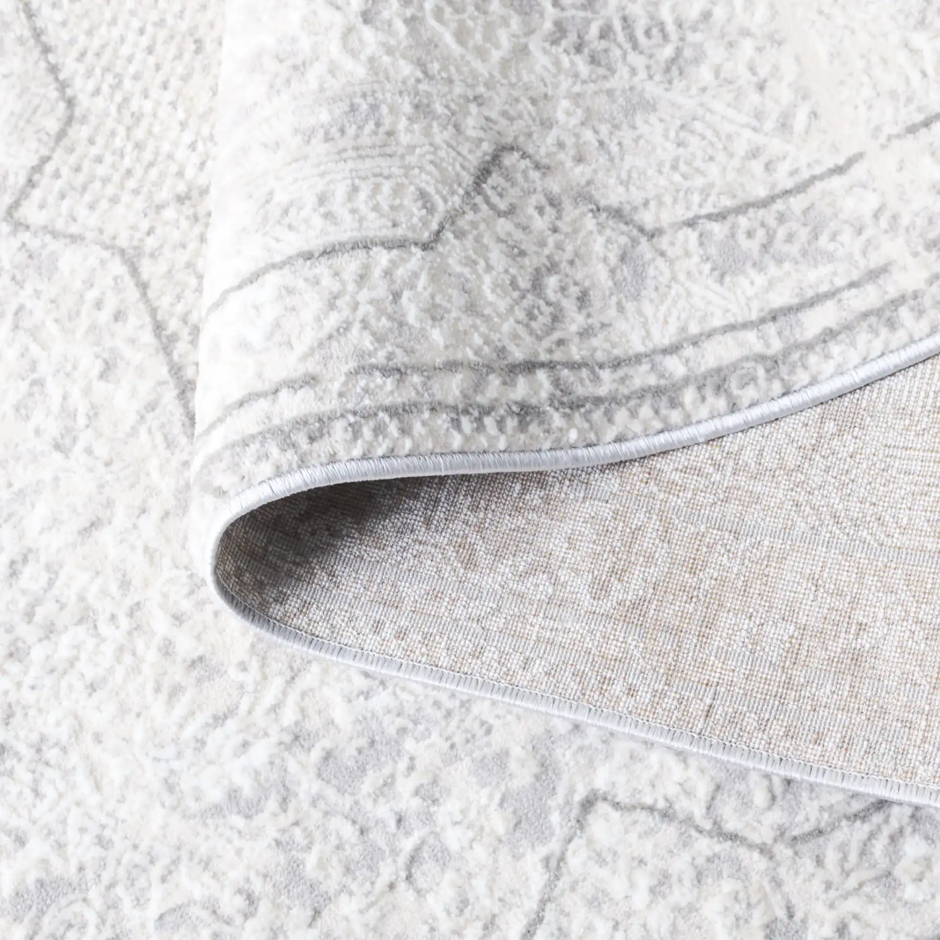 Martha Stewart Easton Distressed Medallion Rug in Ivory / Gray in a styled room