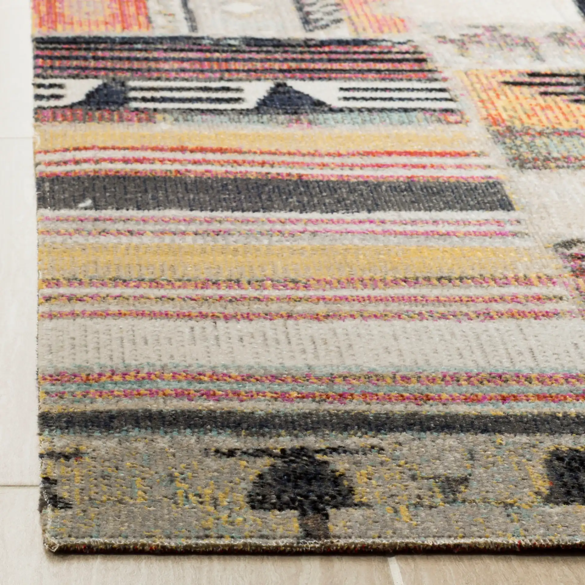 Montage Patchwork Panel Outdoor Rug in Taupe / Multicolor in a styled room