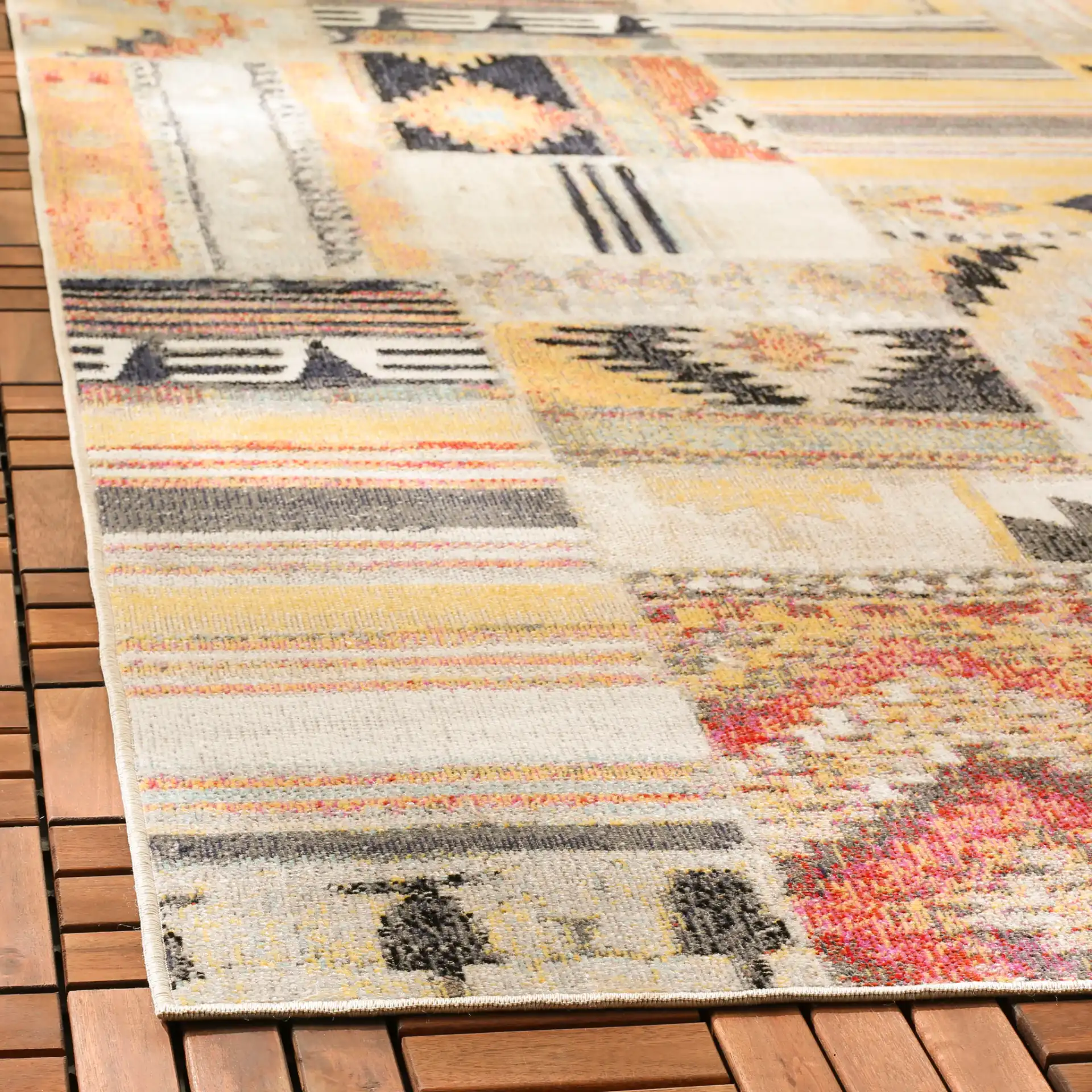 Montage Patchwork Panel Outdoor Rug in Taupe / Multicolor in a styled room