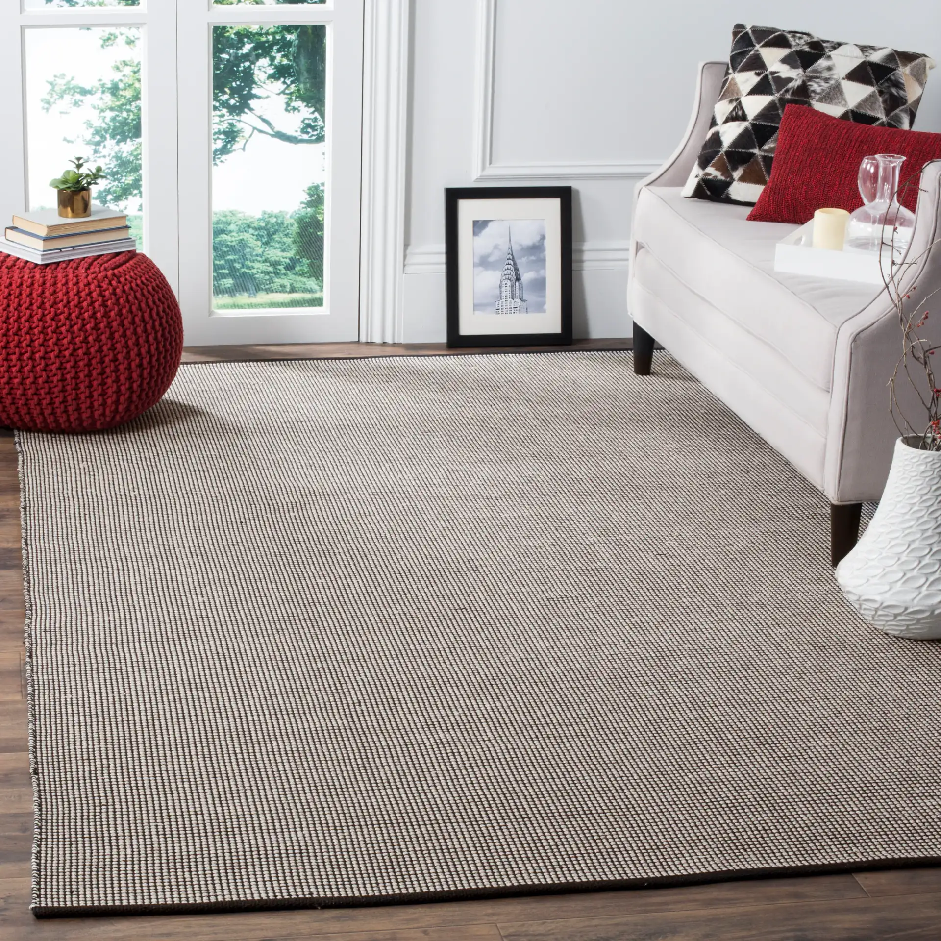 Montauk Grid Hand-Woven Cotton Rug in Ivory / Black in a styled room