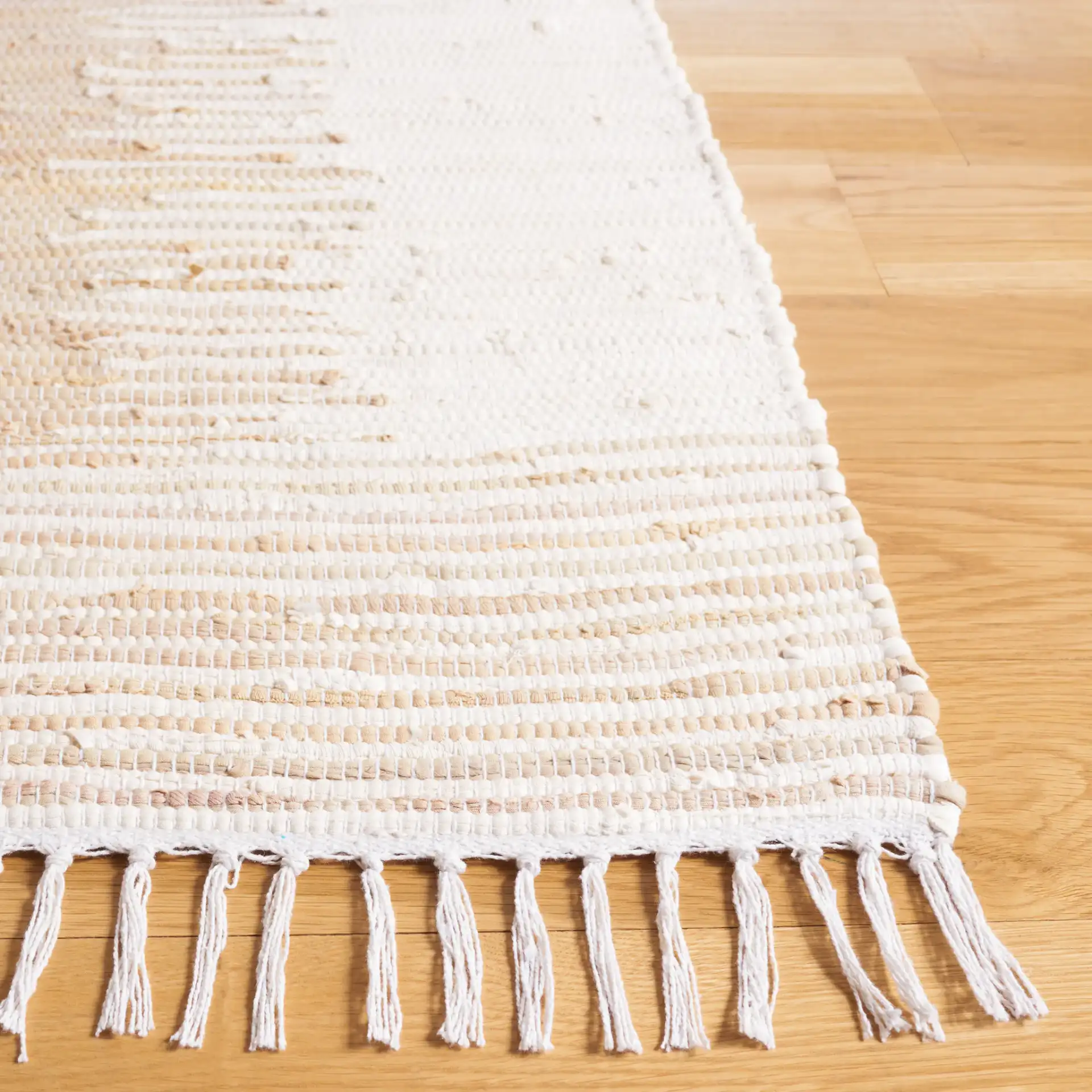 Montauk Double Vertical Stripe Hand-Woven Cotton Rug in Beige in a styled room