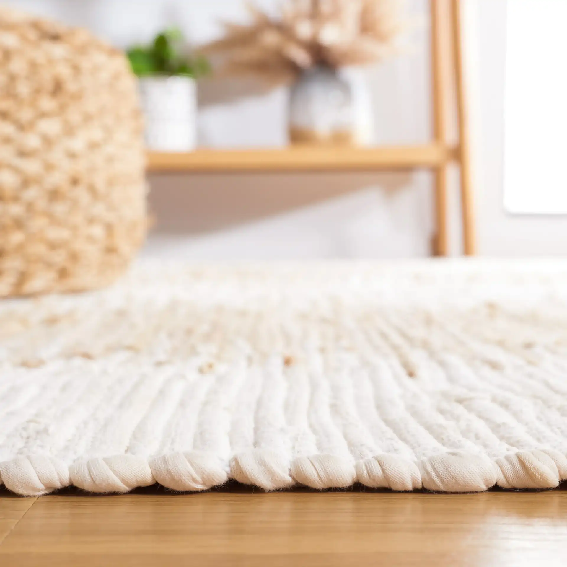 Montauk Double Vertical Stripe Hand-Woven Cotton Rug in Beige in a styled room