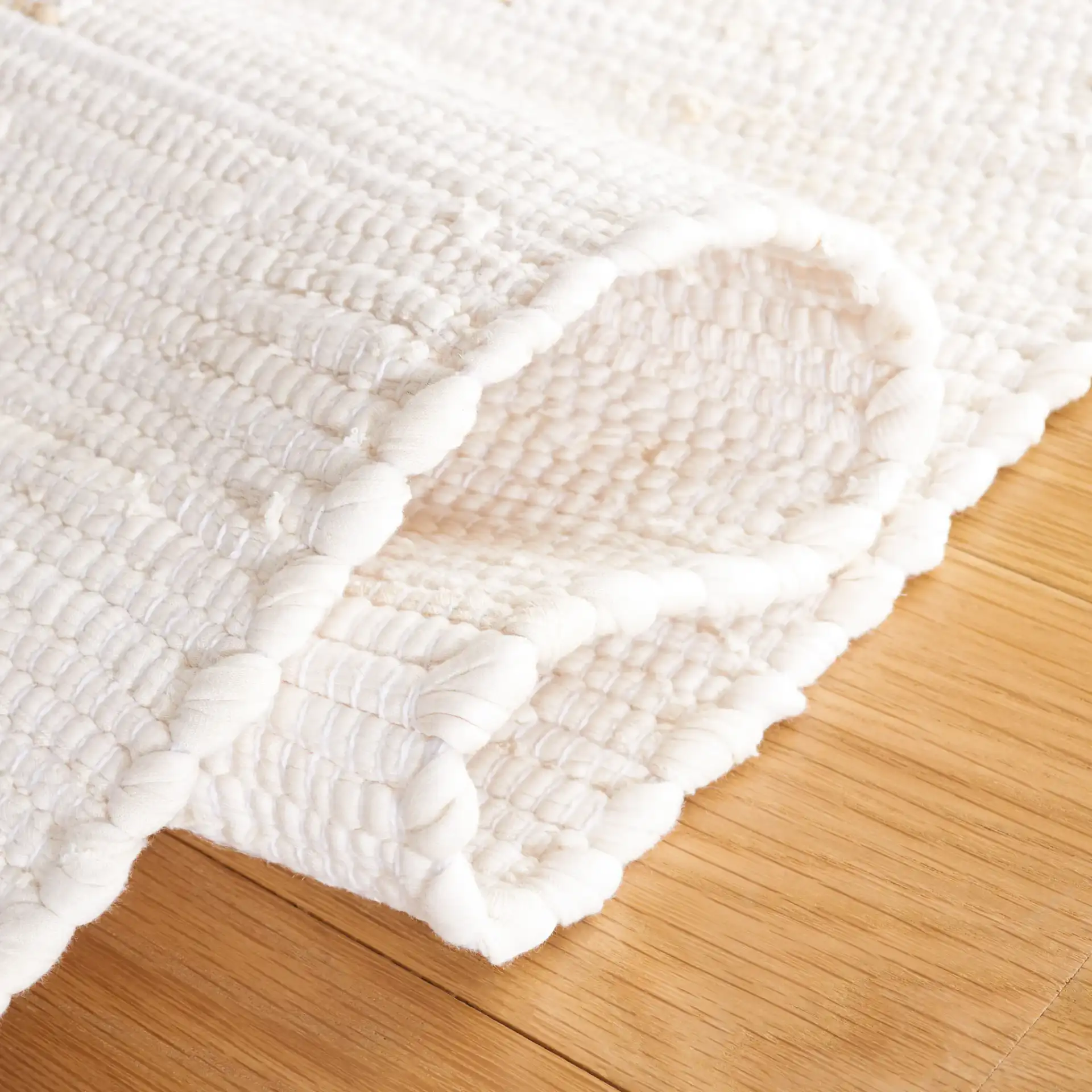 Montauk Double Vertical Stripe Hand-Woven Cotton Rug in Beige in a styled room