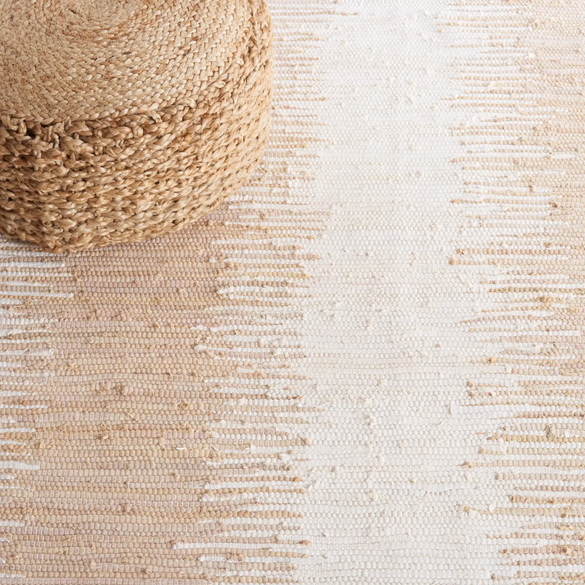 Montauk Double Vertical Stripe Hand-Woven Cotton Rug in Beige in a styled room