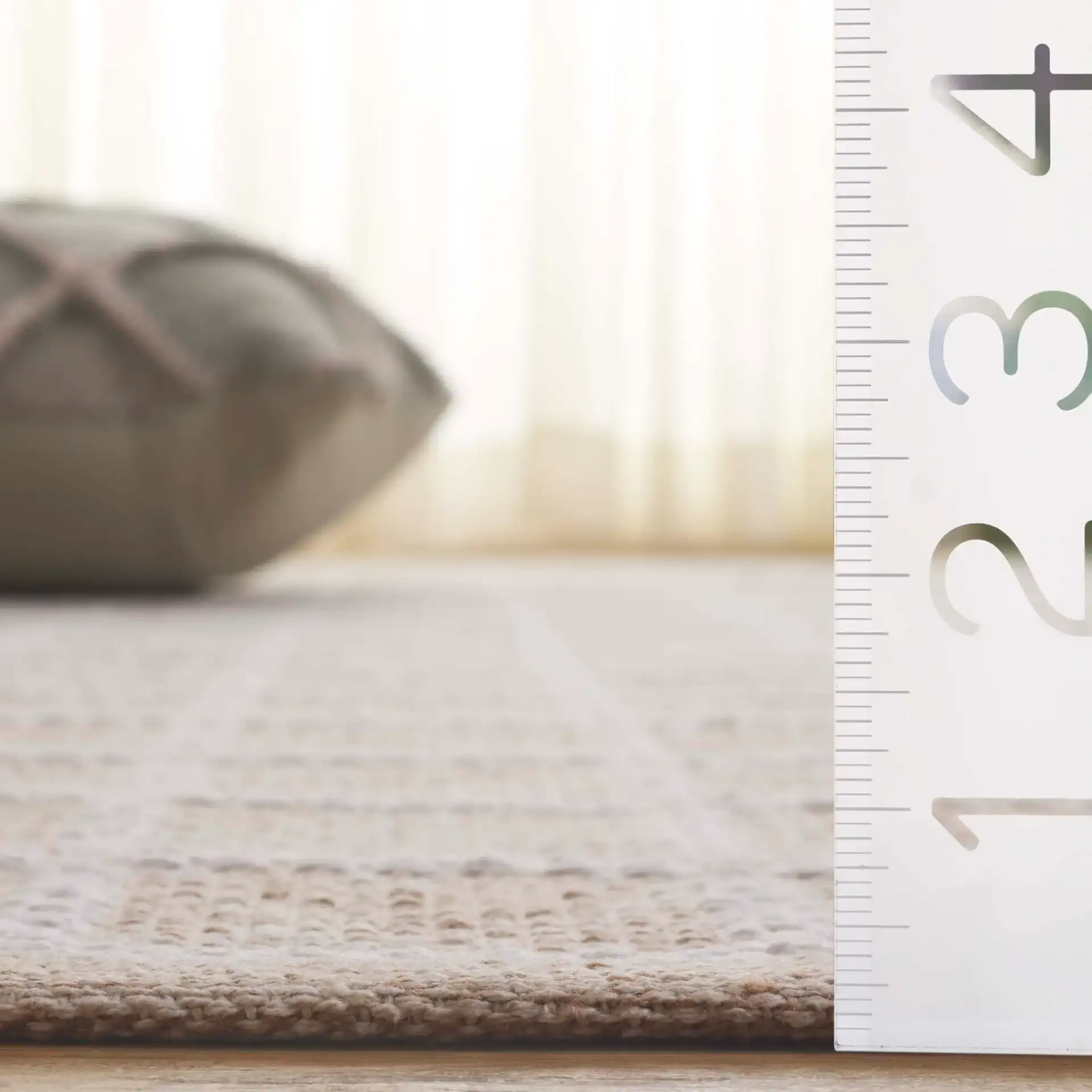 Montauk Waffle Grid Hand-Loomed Cotton Rug in Beige / Ivory in a styled room