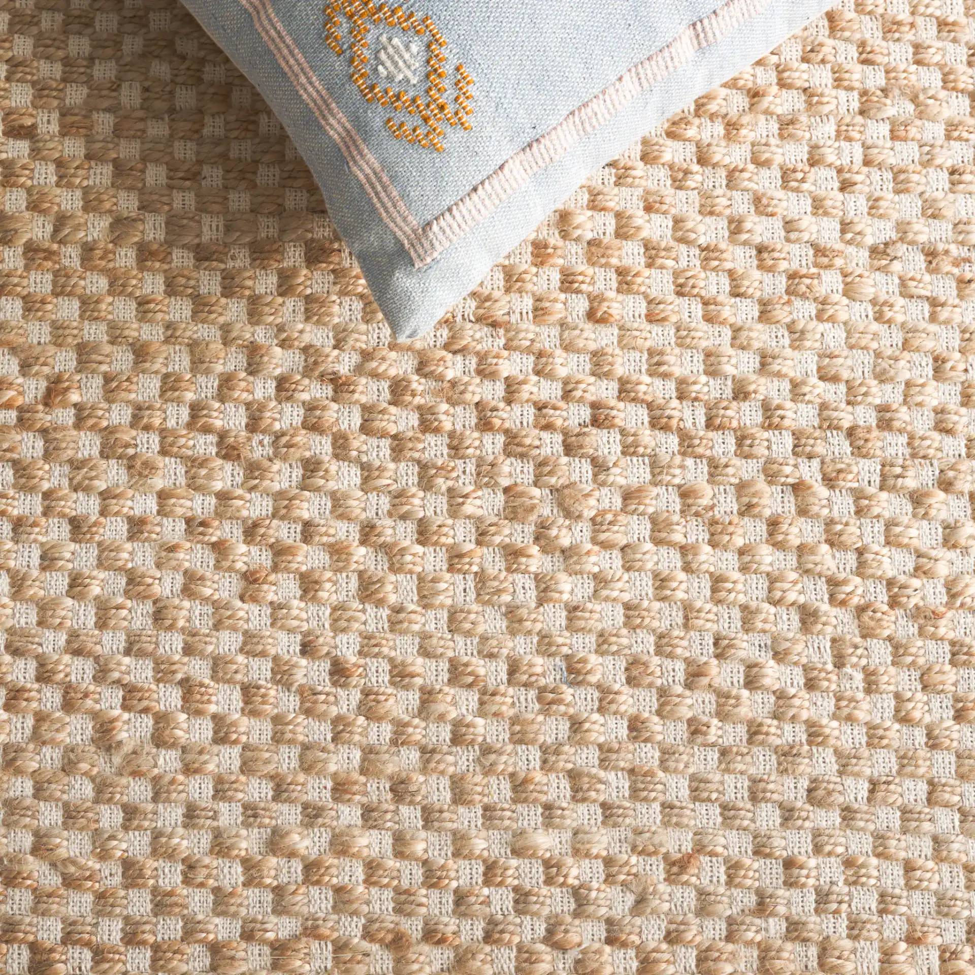 Montauk Checkered Hand-Loomed Rug in Natural / Yellow in a styled room