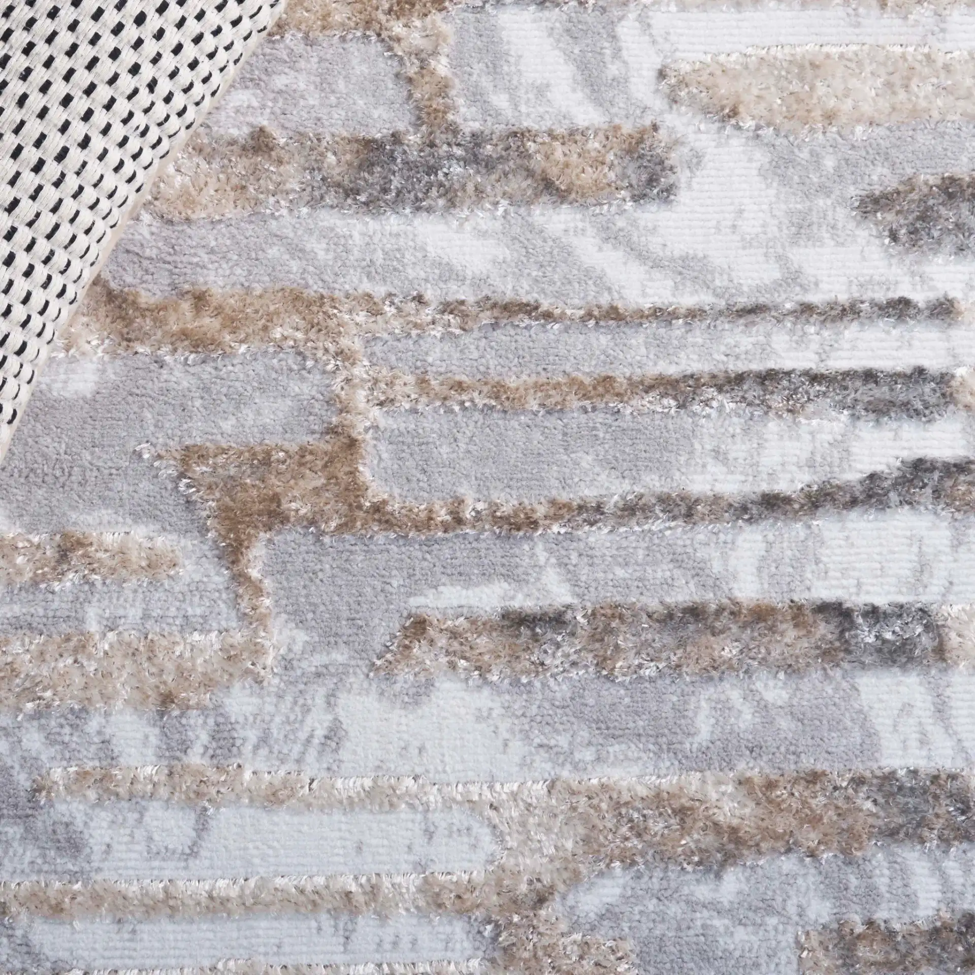 Maya Striated Abstract Rug in Ivory / Gray Beige in a styled room