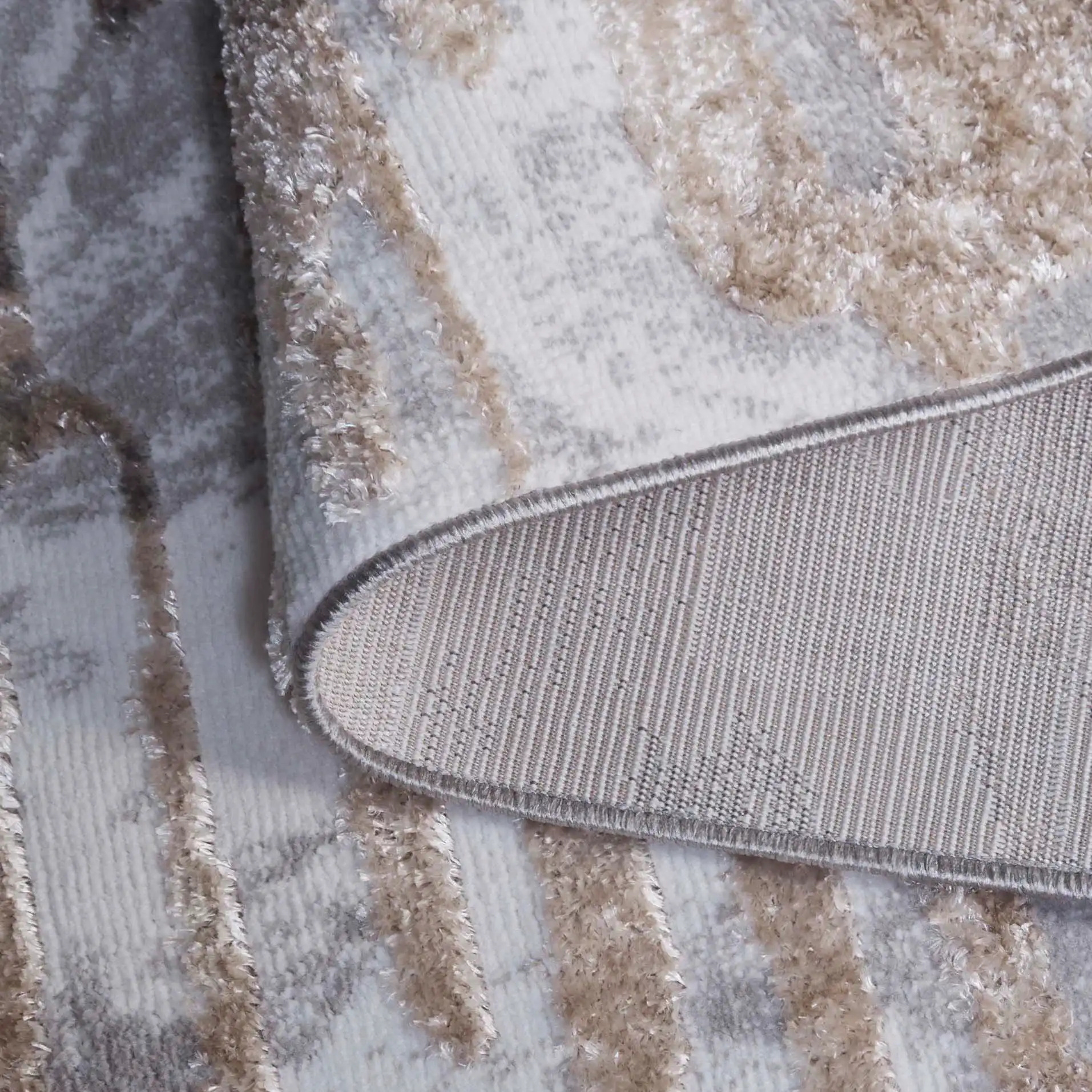 Maya Striated Abstract Rug in Ivory / Gray Beige in a styled room
