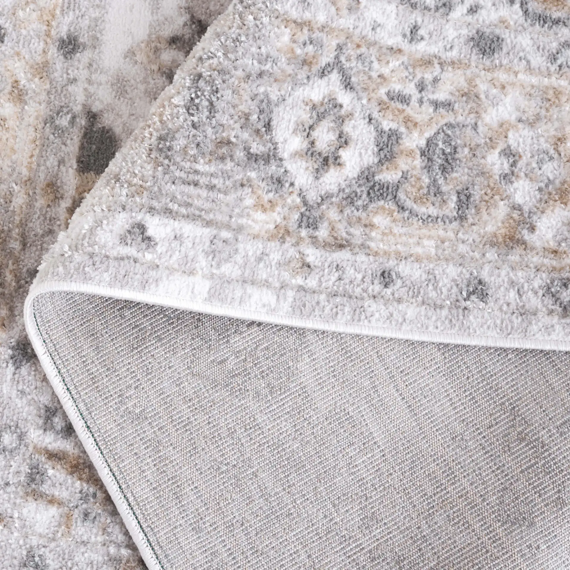 Maya Distressed Medallion Rug in Ivory / Gray Beige in a styled room