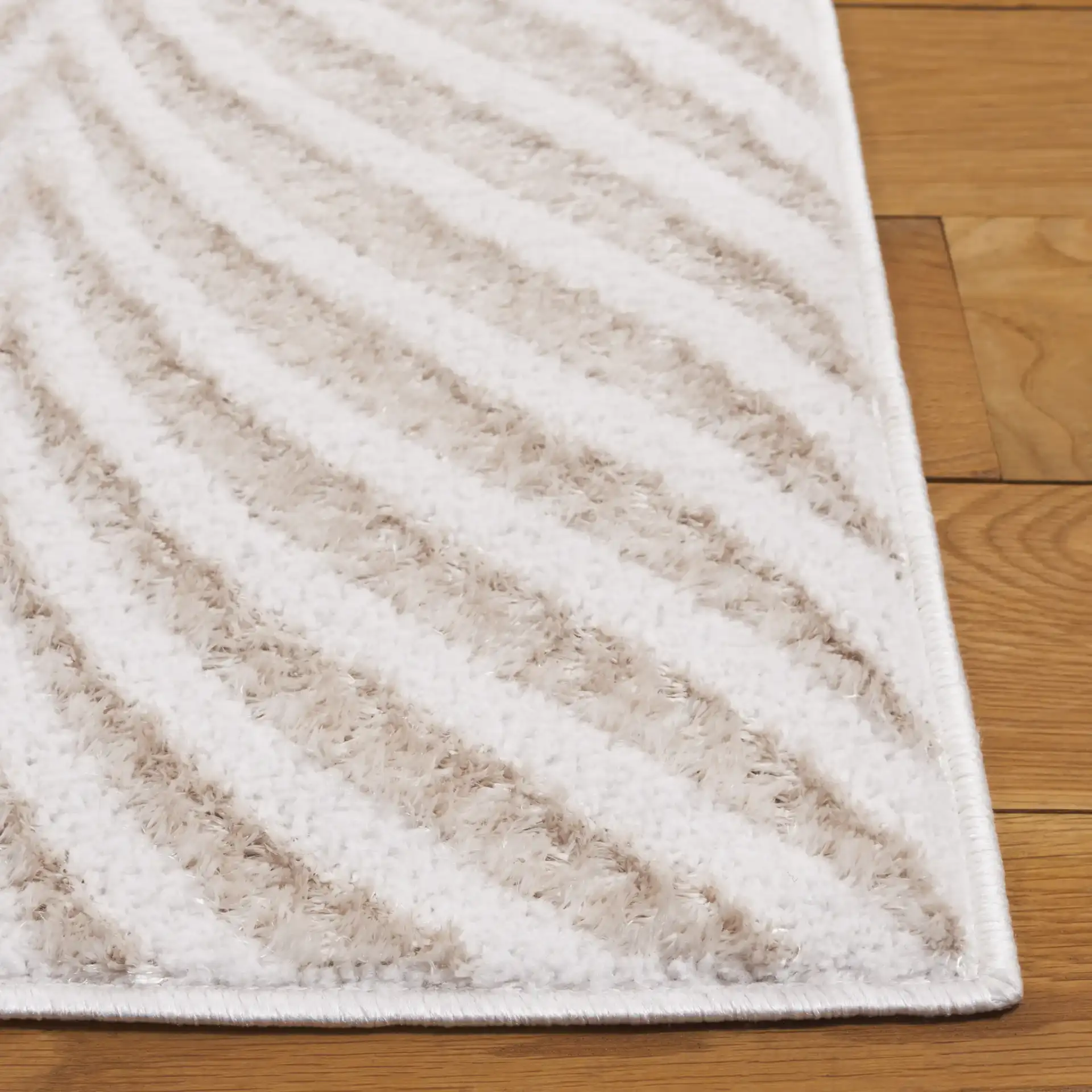 Maya Chevron Rug in Ivory / Beige in a styled room