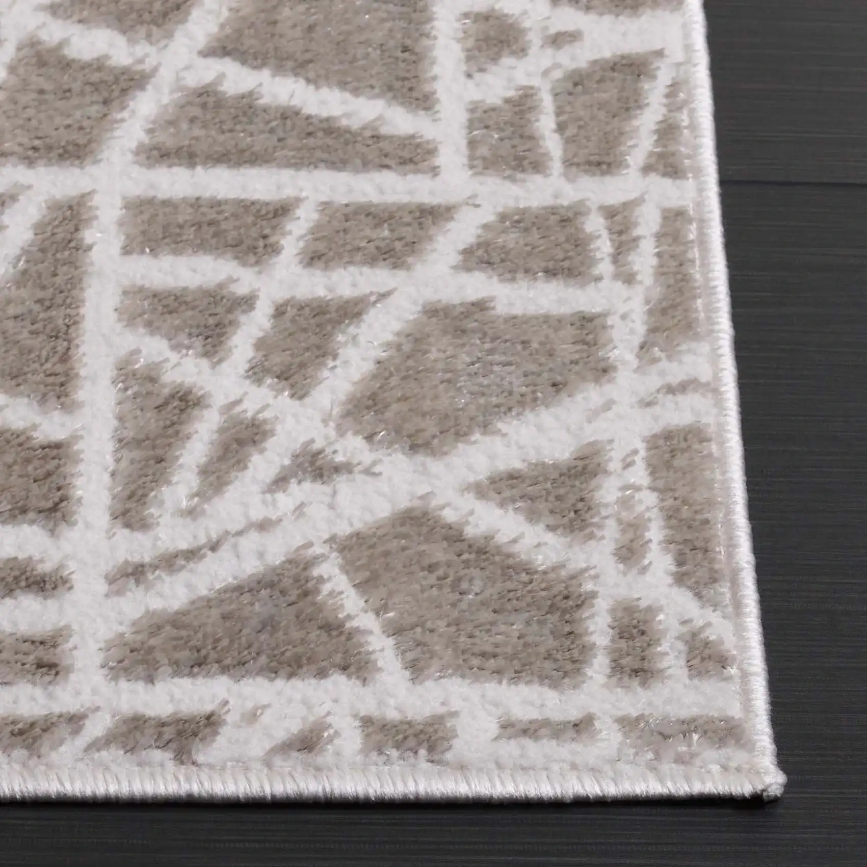 Maya Abstract Grid Rug in Taupe / Gray in a styled room
