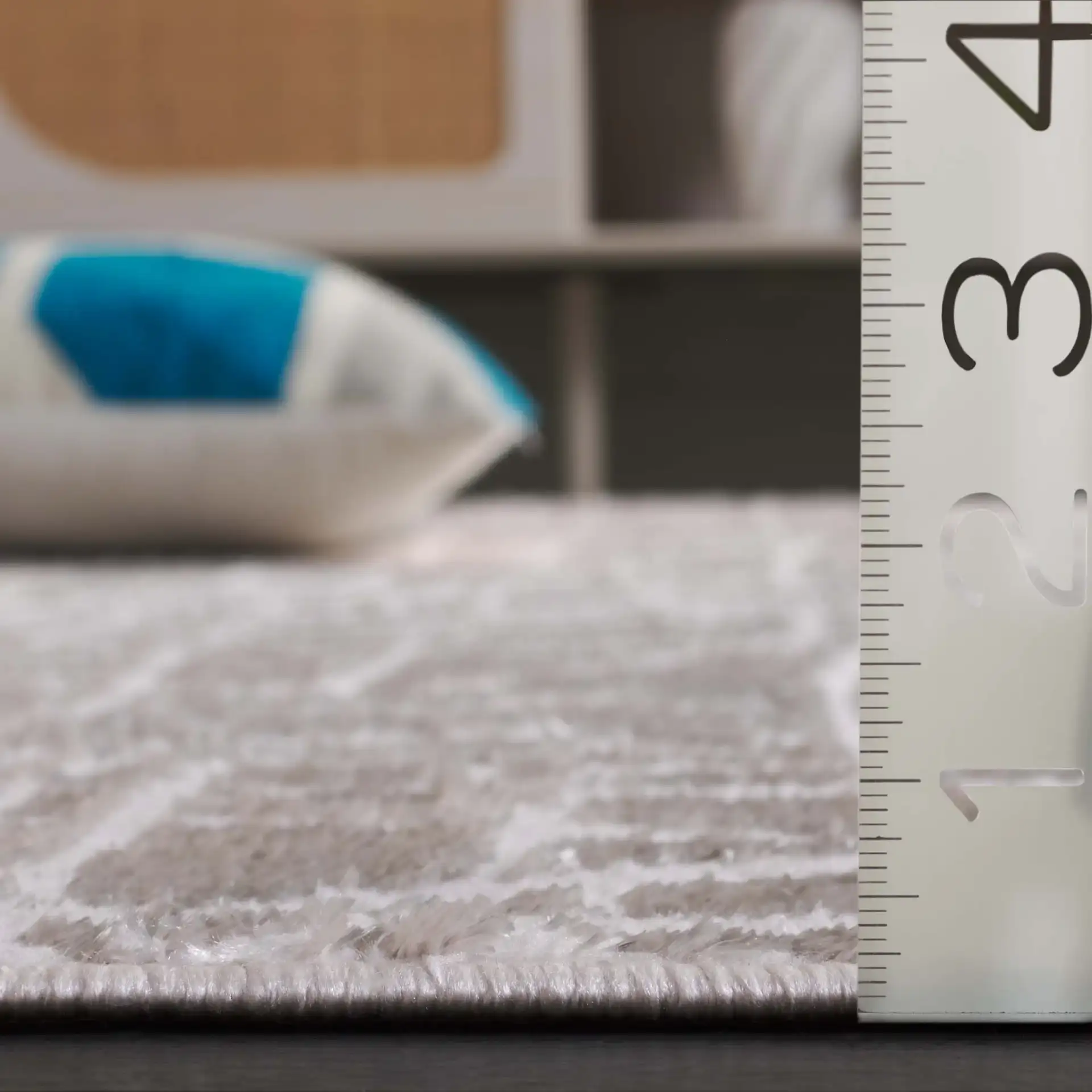 Maya Abstract Grid Rug in Taupe / Gray in a styled room