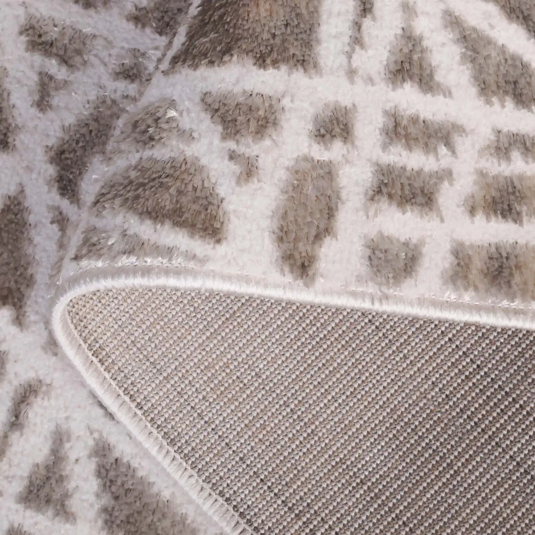 Maya Abstract Grid Rug in Taupe / Gray in a styled room