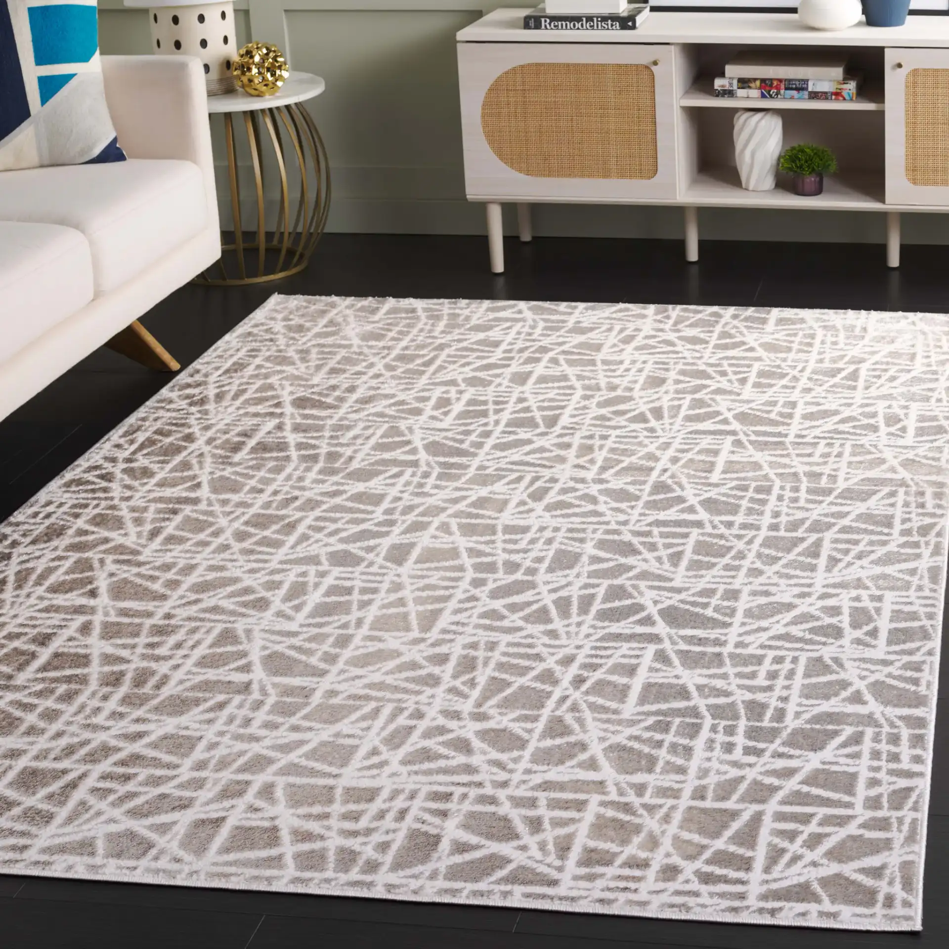Maya Abstract Grid Rug in Taupe / Gray in a styled room