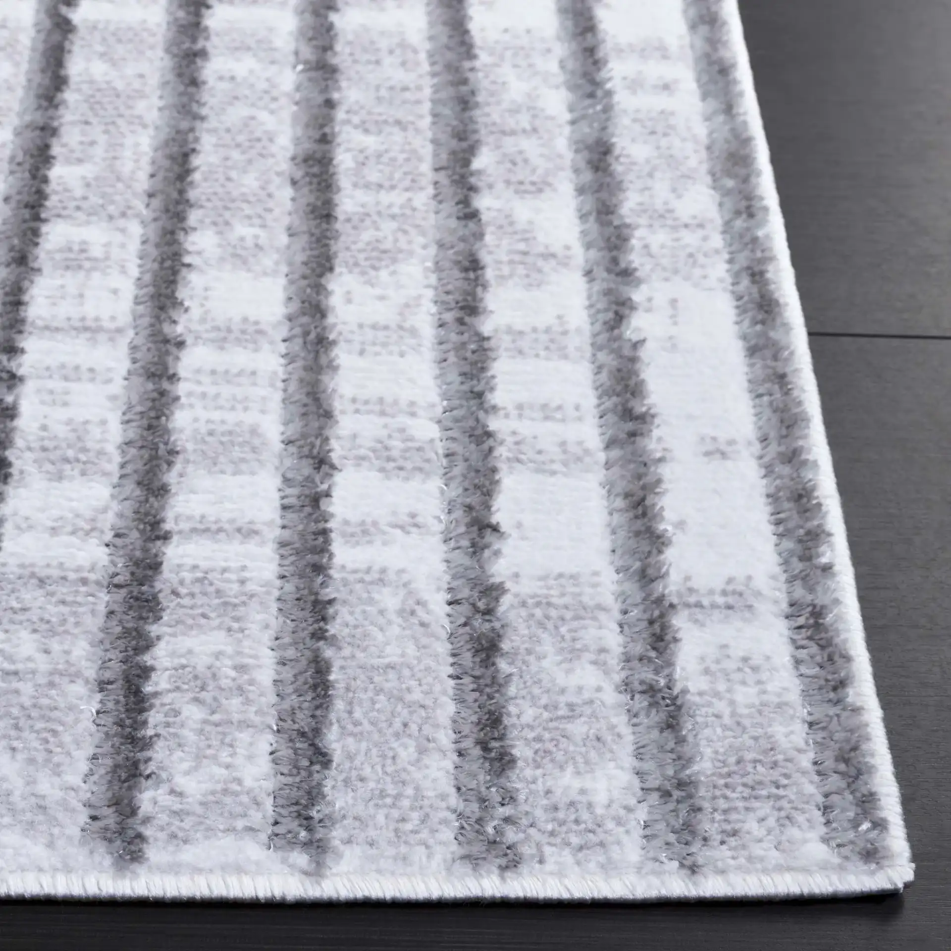 Maya Angled Stripe Rug in Ivory / Gray in a styled room
