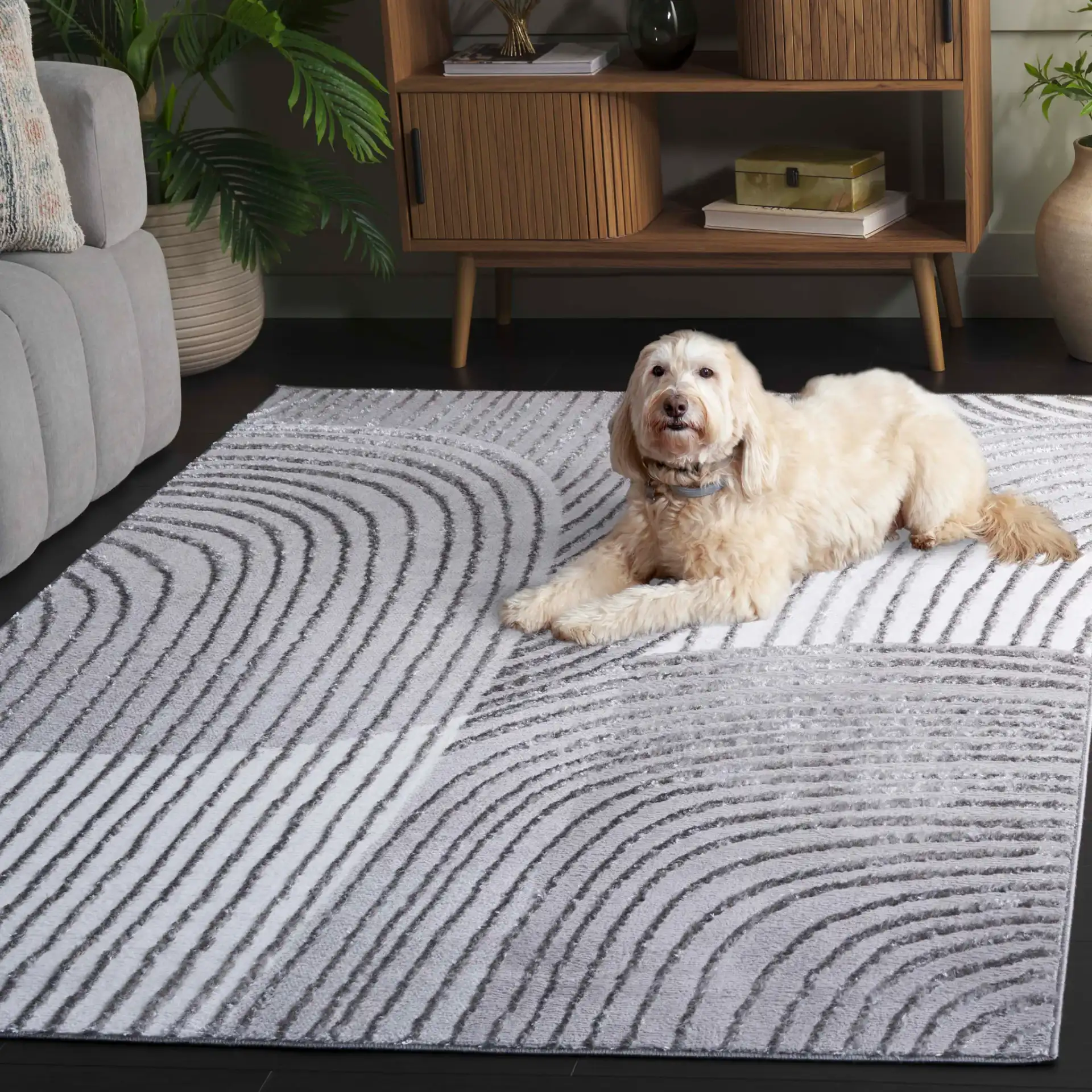 Maya Curved Stripe Rug in Ivory / Gray in a styled room