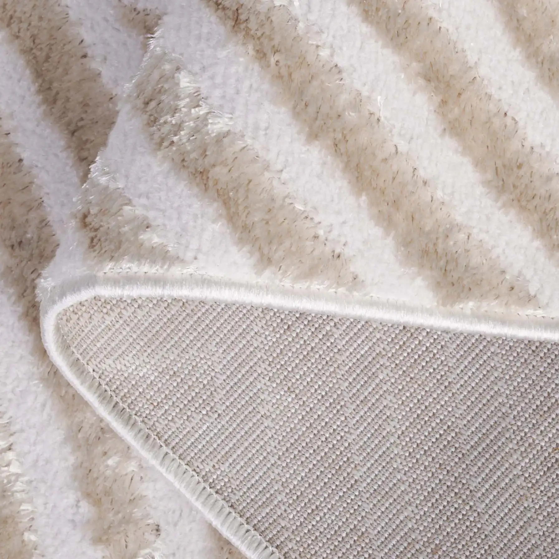 Maya Overlapping Arch Rug in Taupe / Ivory in a styled room