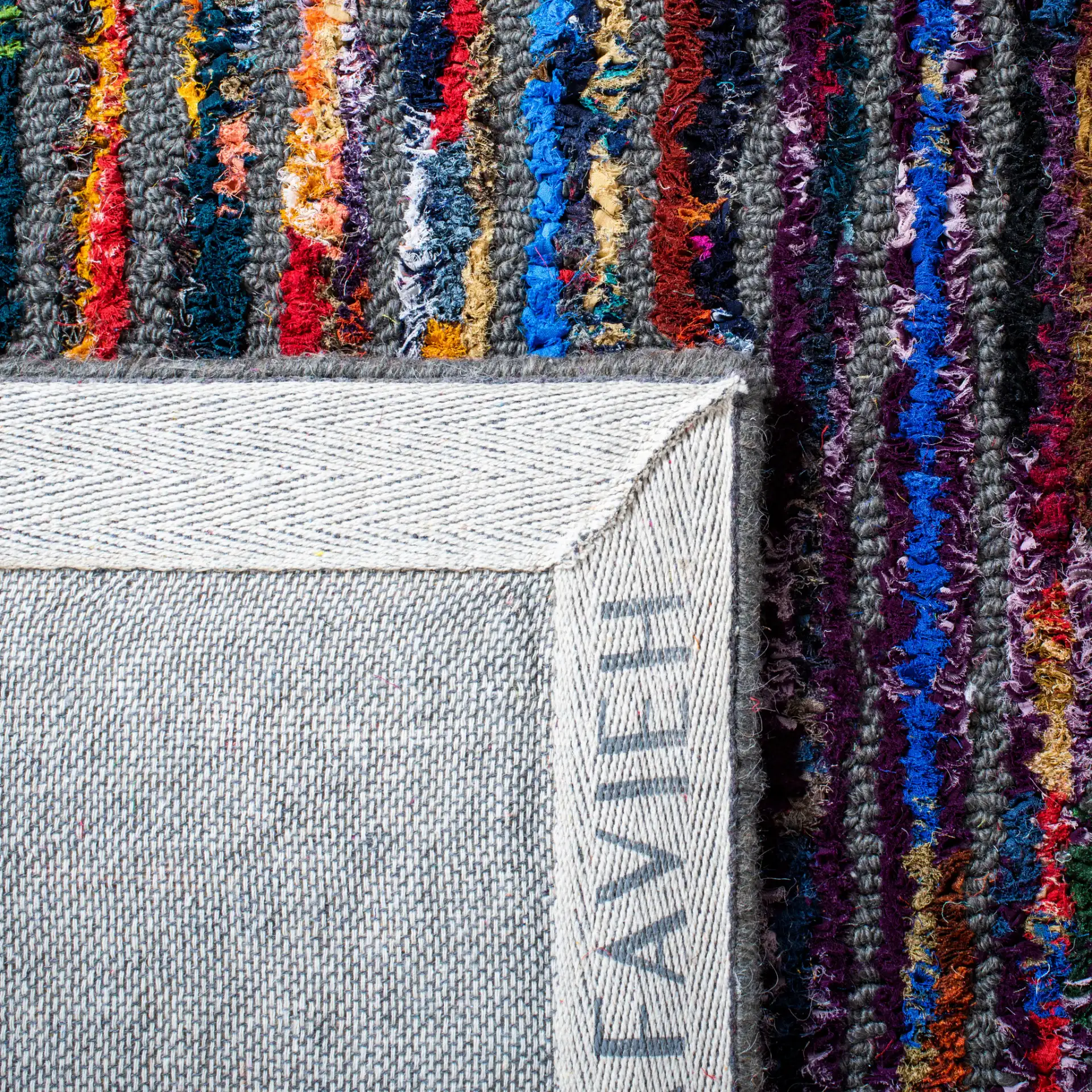 Nantucket Patchwork Blocks Hand-Tufted Rug in Charcoal in a styled room