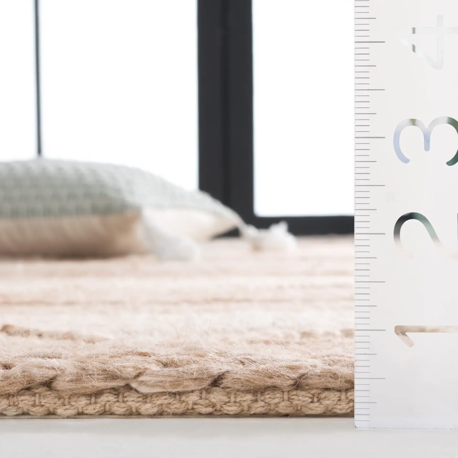 Natura Striped Chevron Hand-Woven Rug in Beige in a styled room