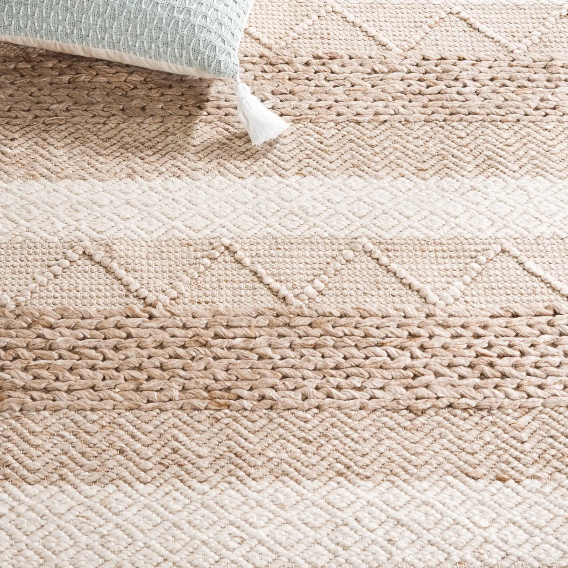 Natura Striped Chevron Hand-Woven Rug in Beige in a styled room