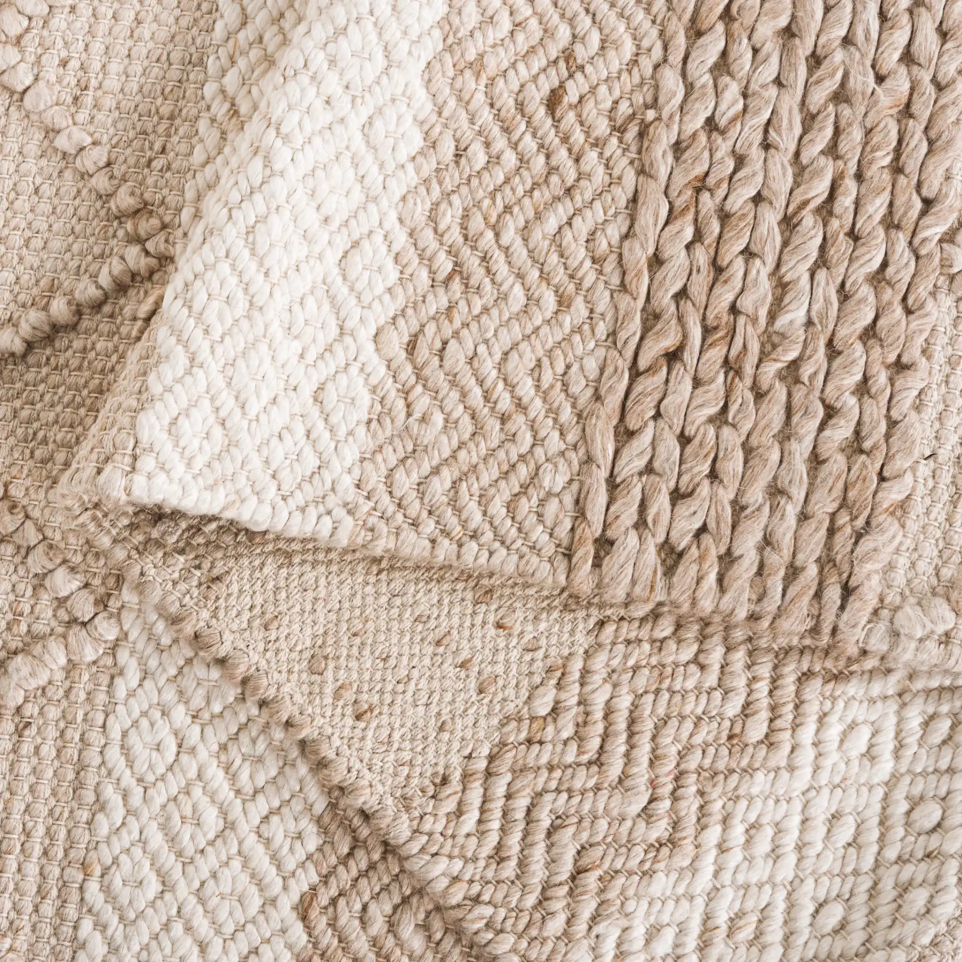Natura Striped Chevron Hand-Woven Rug in Beige in a styled room