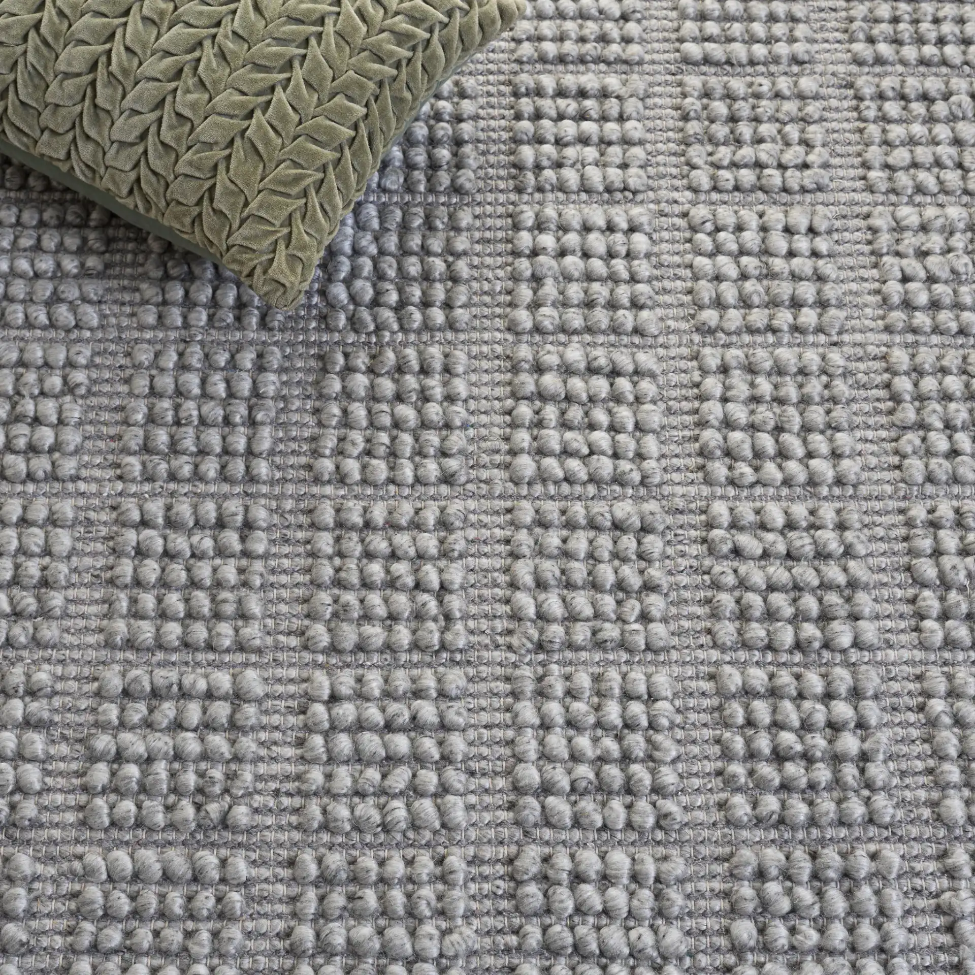 Natura Textured Grid Hand-Woven Rug in Gray in a styled room