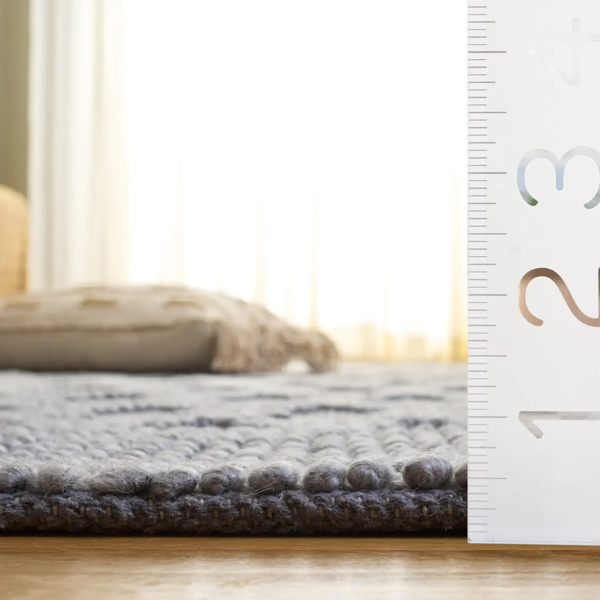 Natura Diamond Lattice Hand-Woven Rug in Gray in a styled room