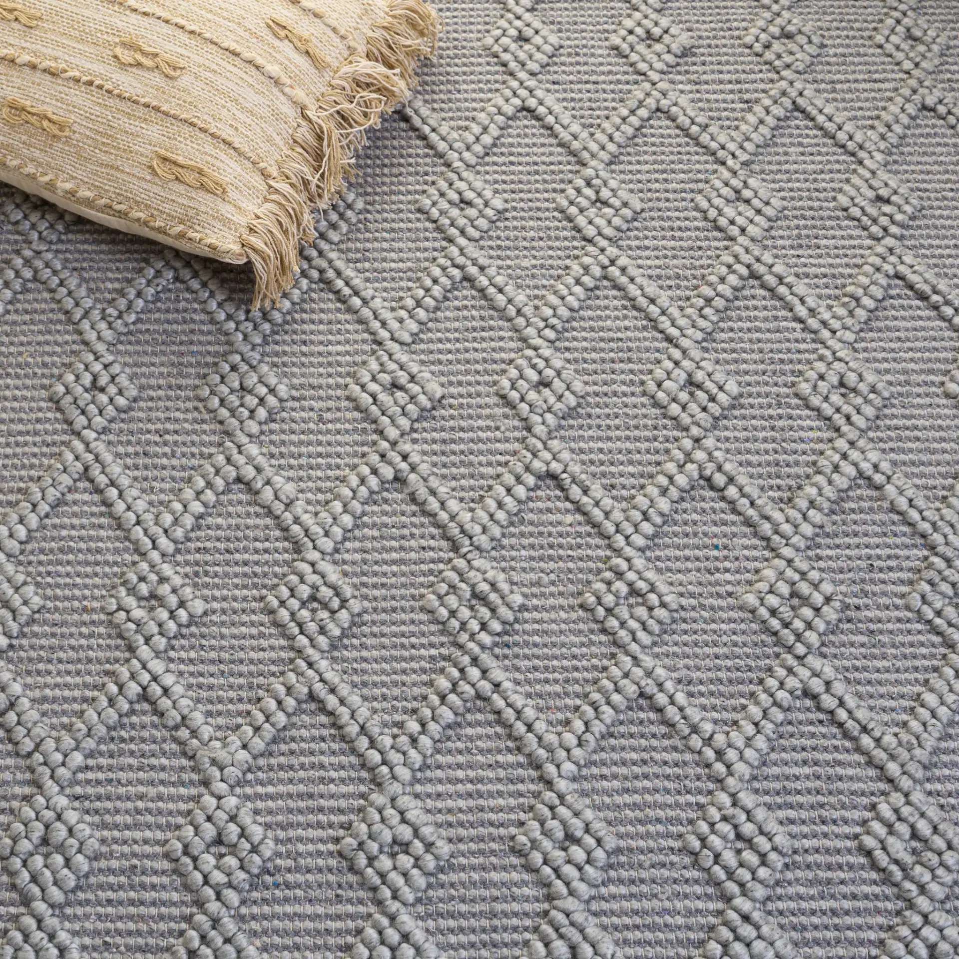 Natura Diamond Lattice Hand-Woven Rug in Gray in a styled room