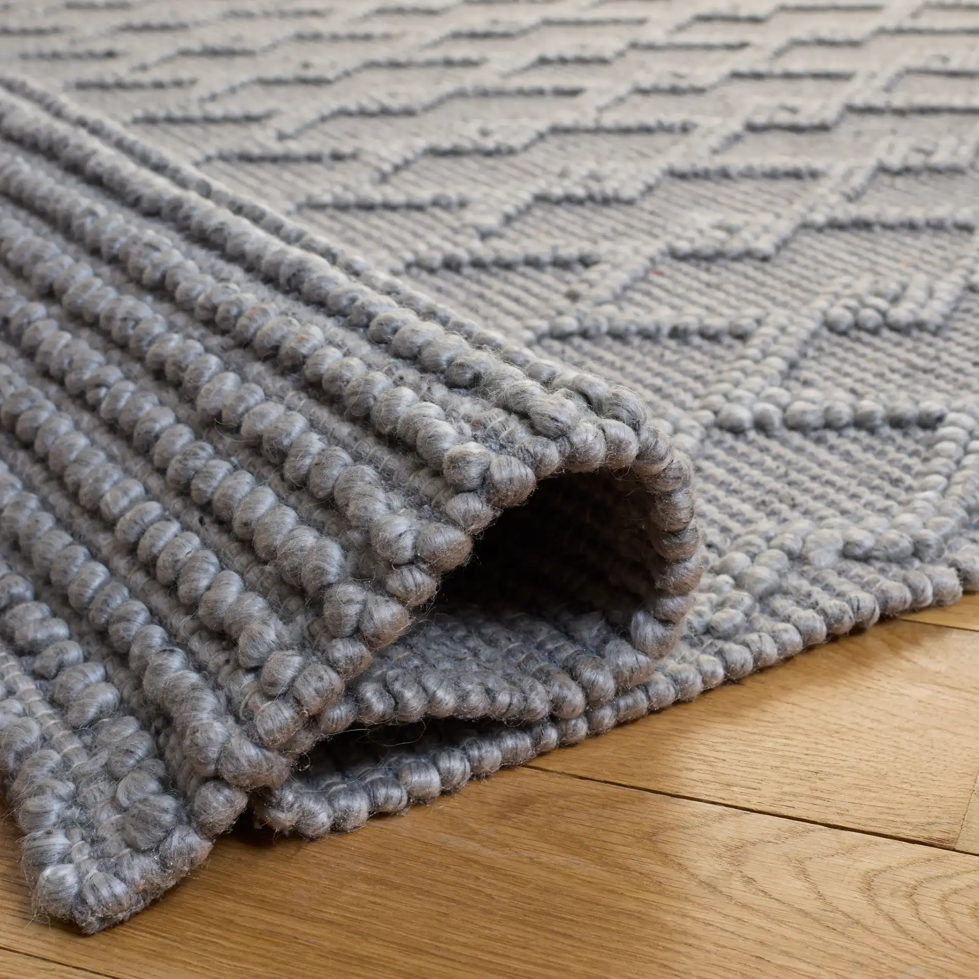 Natura Diamond Lattice Hand-Woven Rug in Gray in a styled room