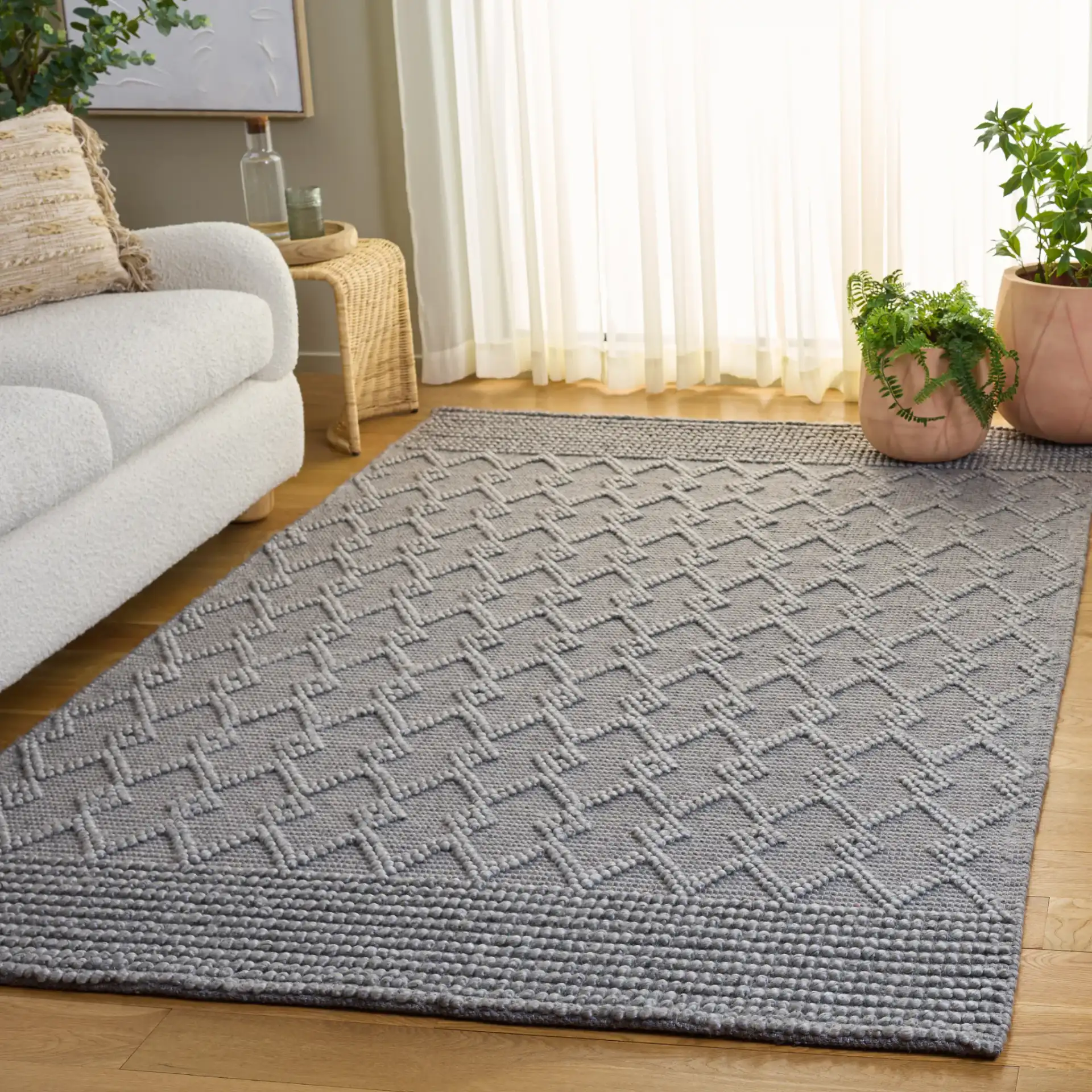 Natura Diamond Lattice Hand-Woven Rug in Gray in a styled room