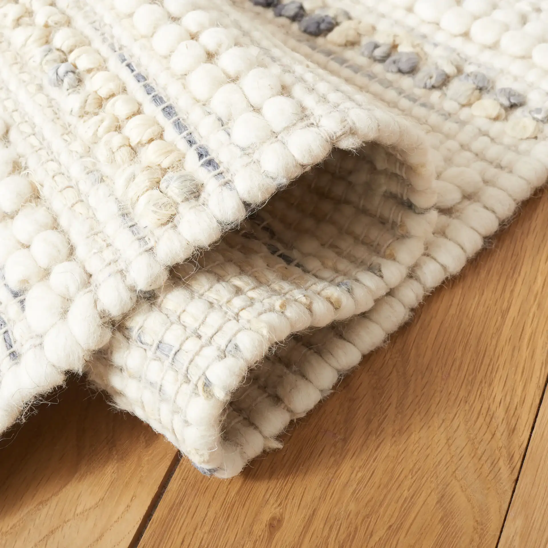Natura Diamond Banded Hand-Loomed Rug in Ivory / Gray in a styled room