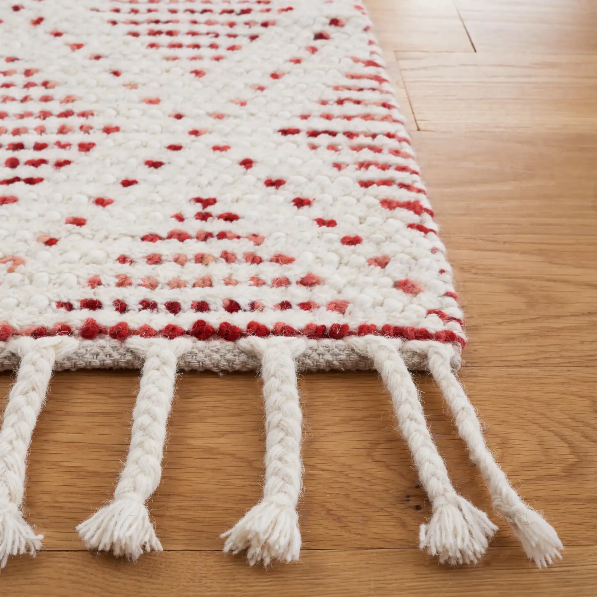 Natura Diamond Hand-Loomed Wool Rug in Ivory / Red in a styled room