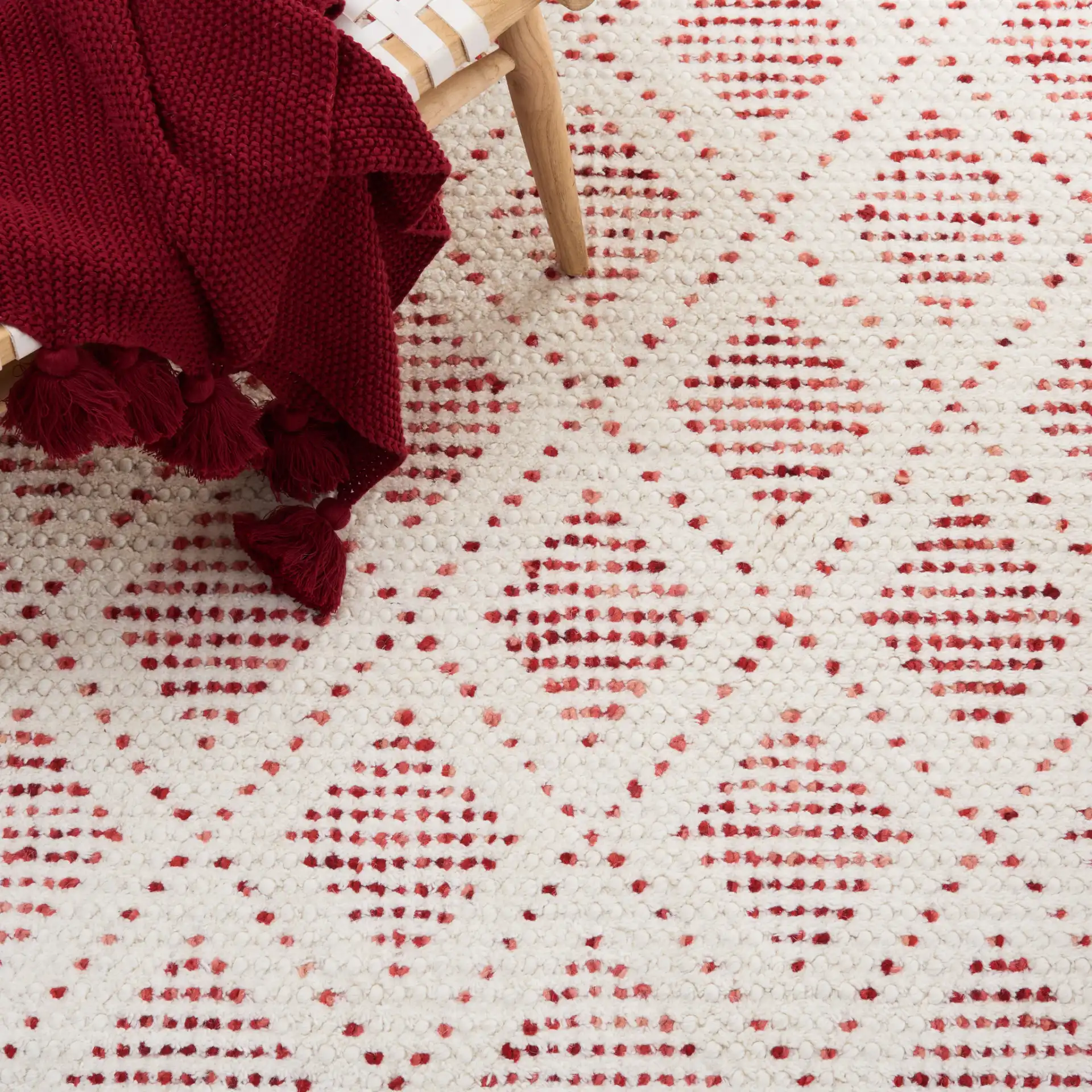 Natura Diamond Hand-Loomed Wool Rug in Ivory / Red in a styled room