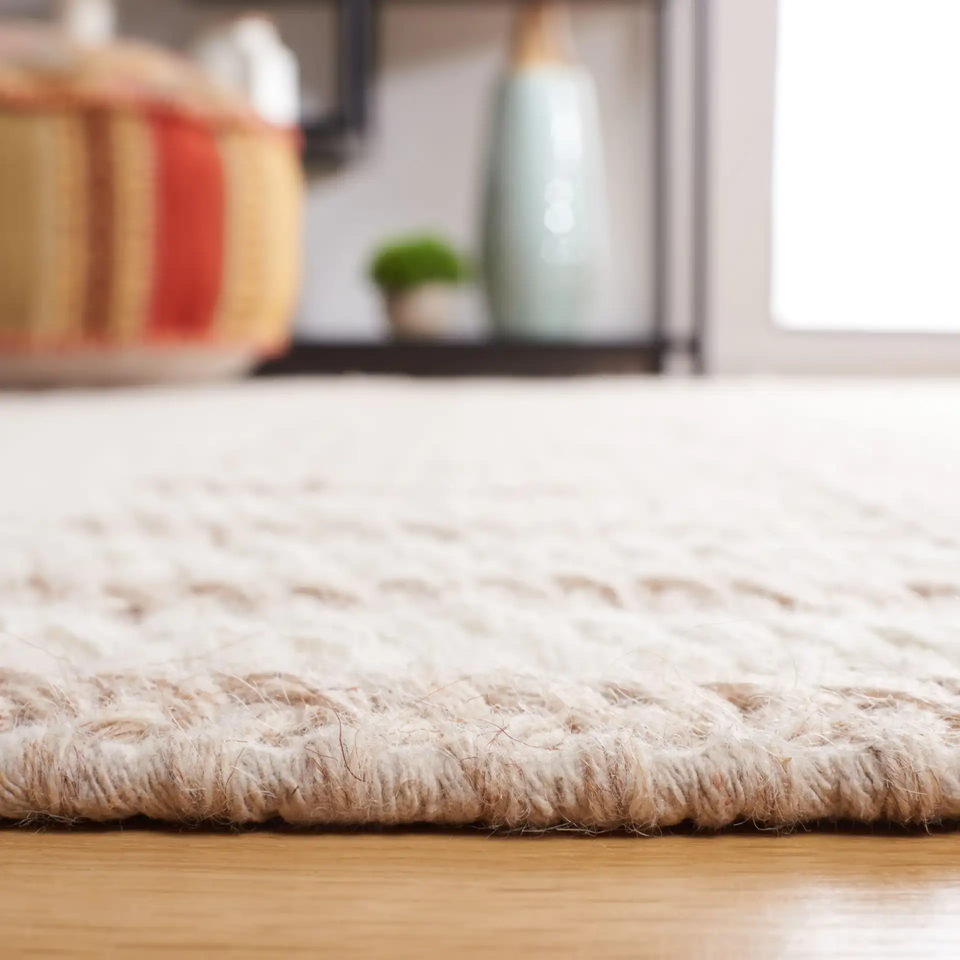 Natura Banded Stripe Hand-Woven Wool Rug in Ivory / Taupe in a styled room