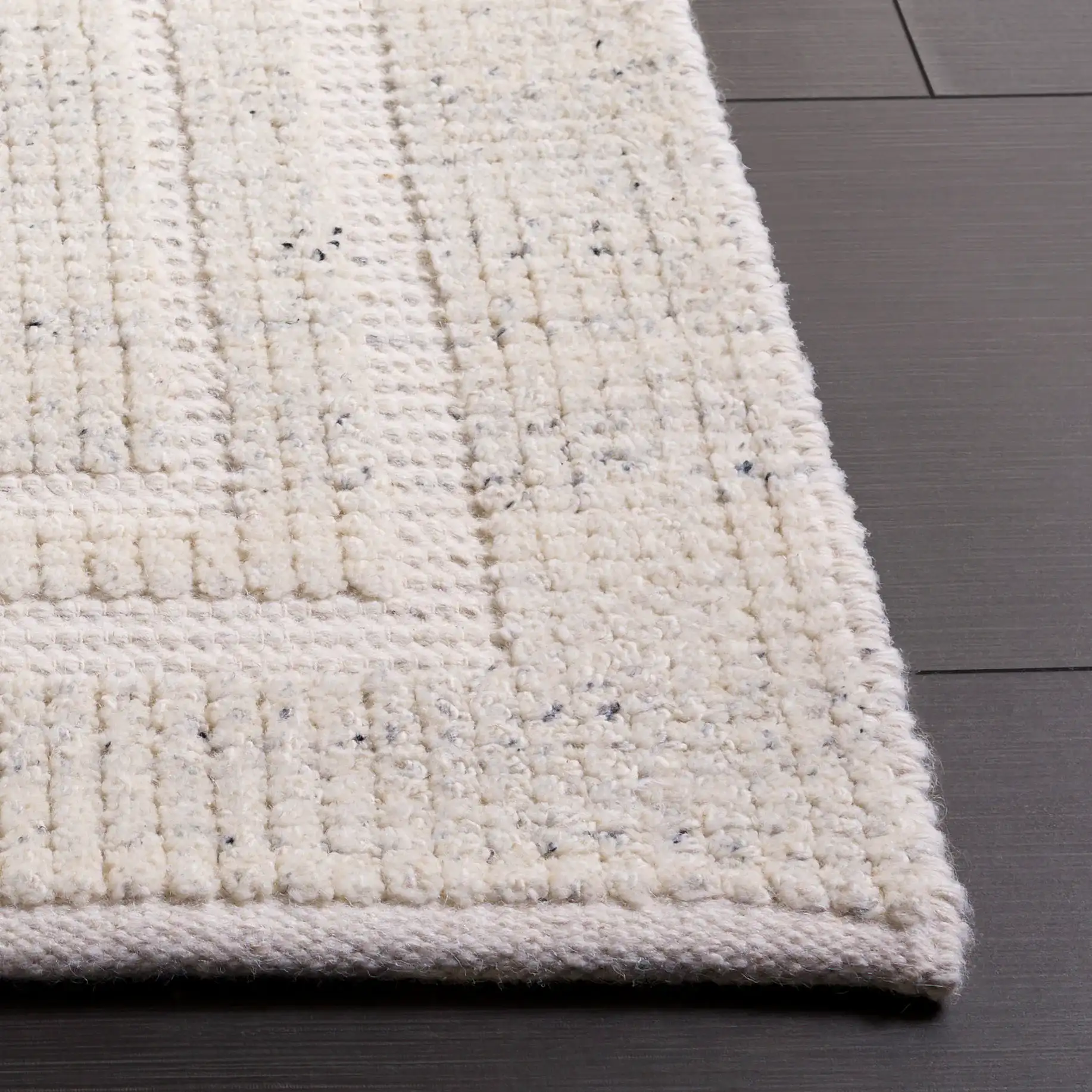 Natura Ribbed Hand-Loomed Wool Rug in Silver in a styled room