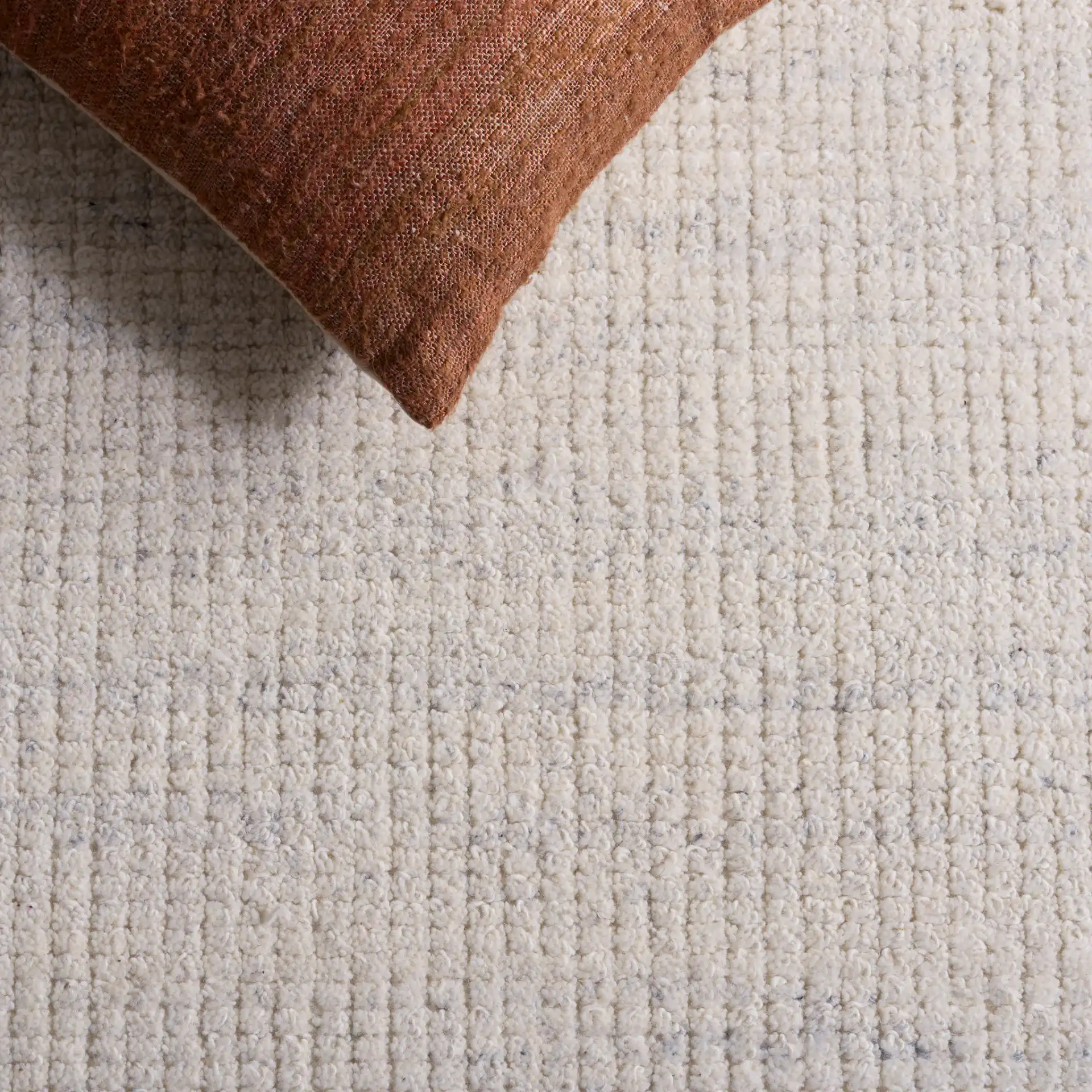 Natura Ribbed Hand-Loomed Wool Rug in Silver in a styled room