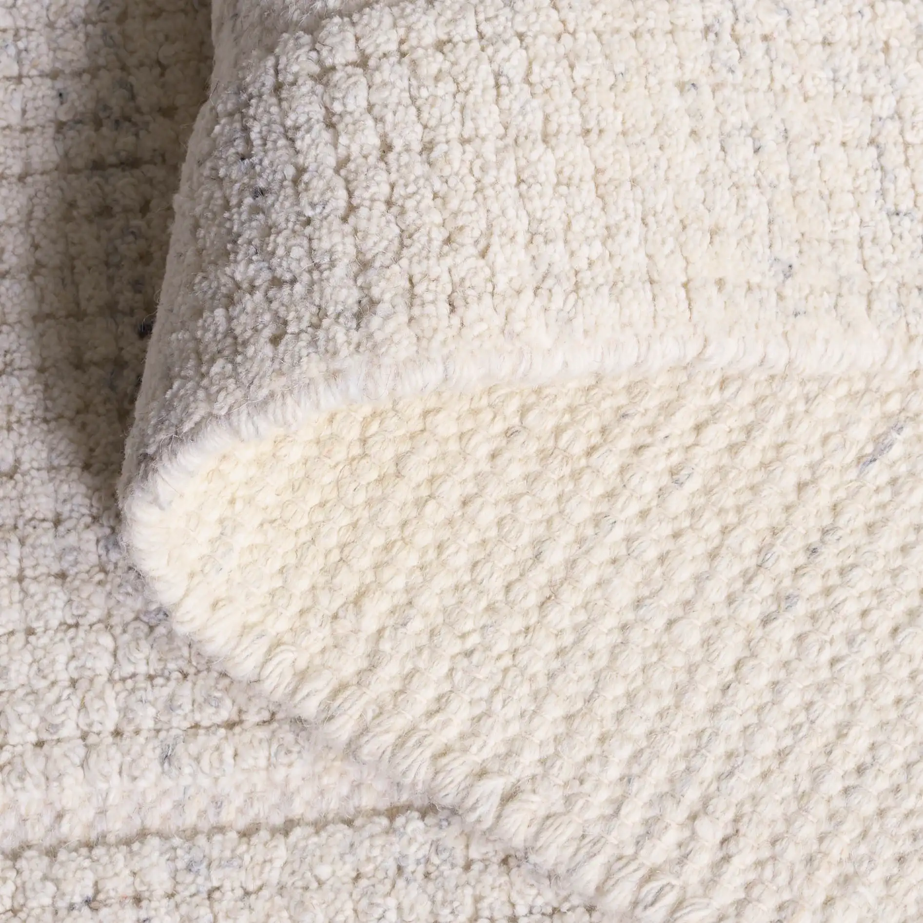 Natura Ribbed Hand-Loomed Wool Rug in Silver in a styled room
