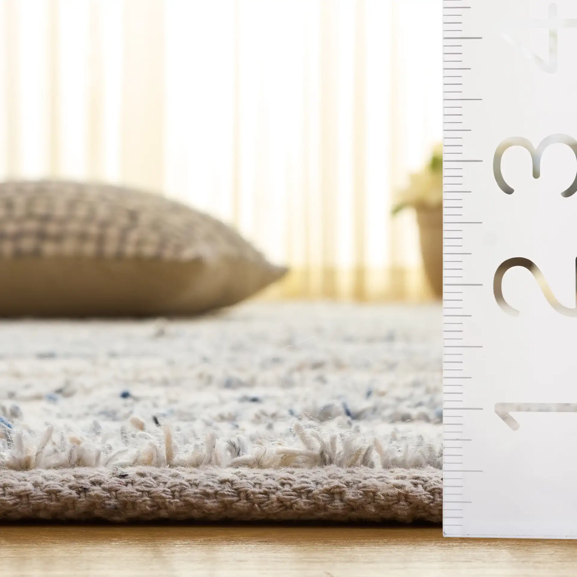 Natura Staggered Stripe Hand-Loomed Wool Blend Rug in Blue / Ivory in a styled room