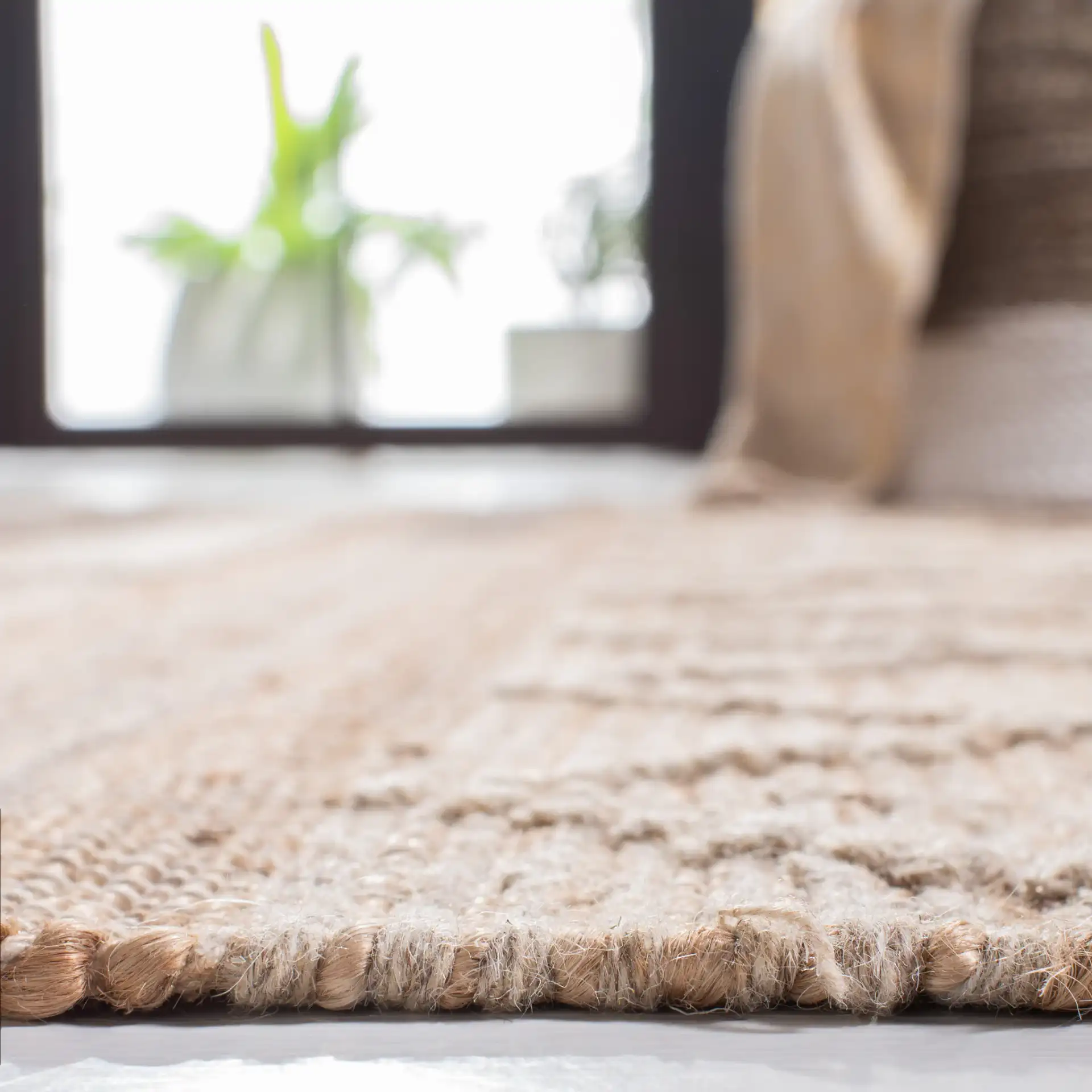 Natura Banded Triangle Flatweave Rug in Natural / Beige in a styled room