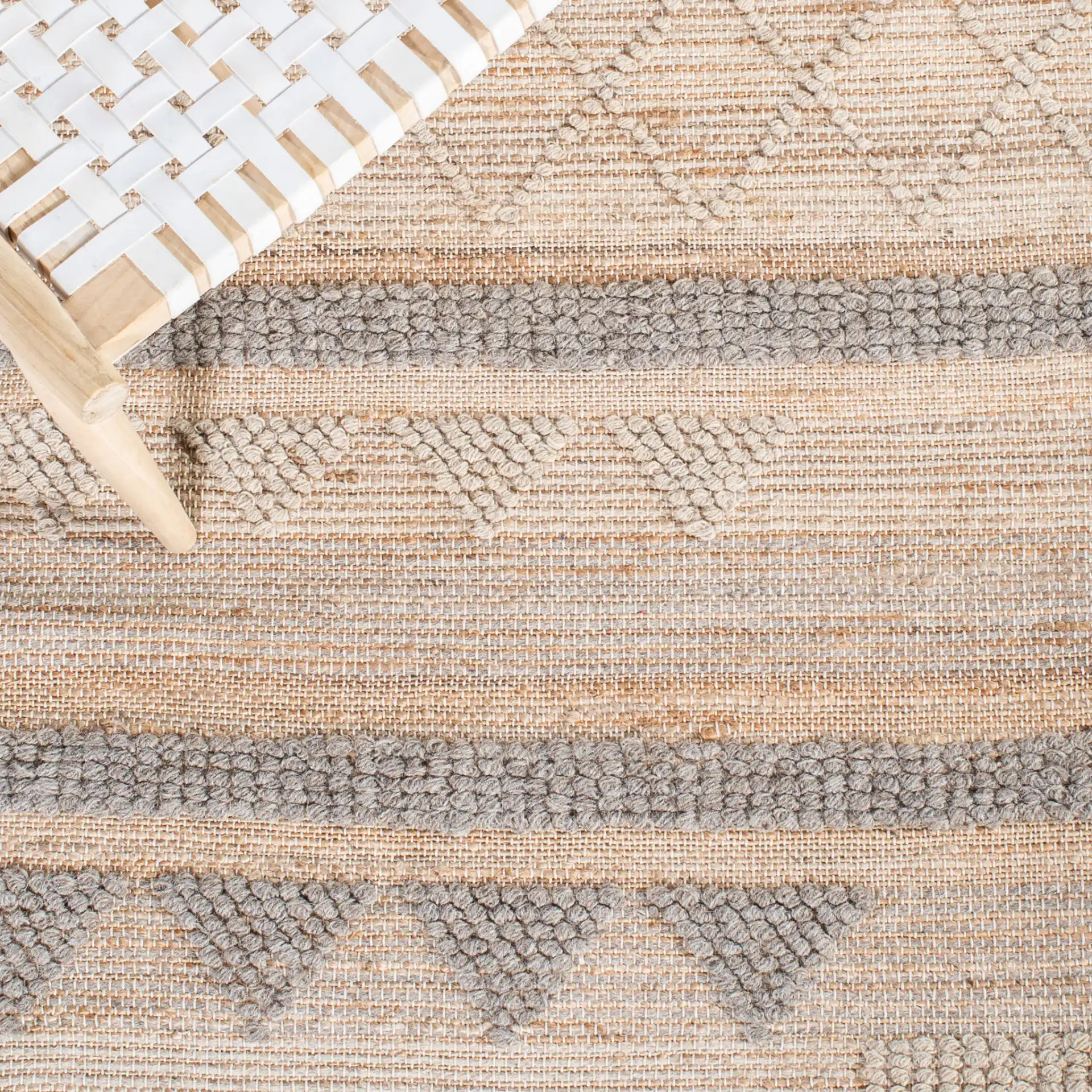 Natura Banded Triangle Flatweave Rug in Natural / Beige in a styled room