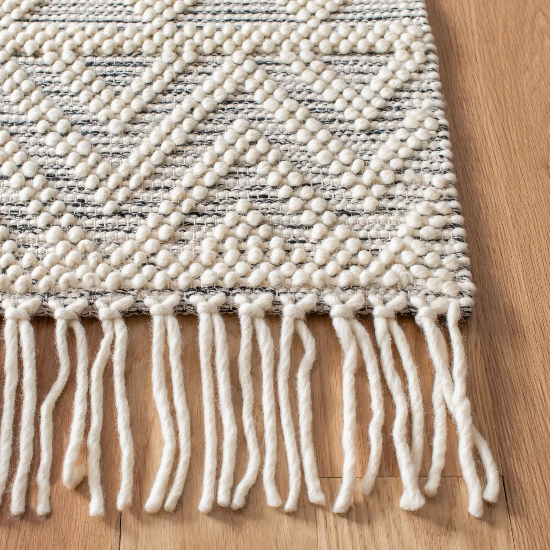 Natura Chevron And Diamond Hand-Loomed Rug in Ivory / Black in a styled room