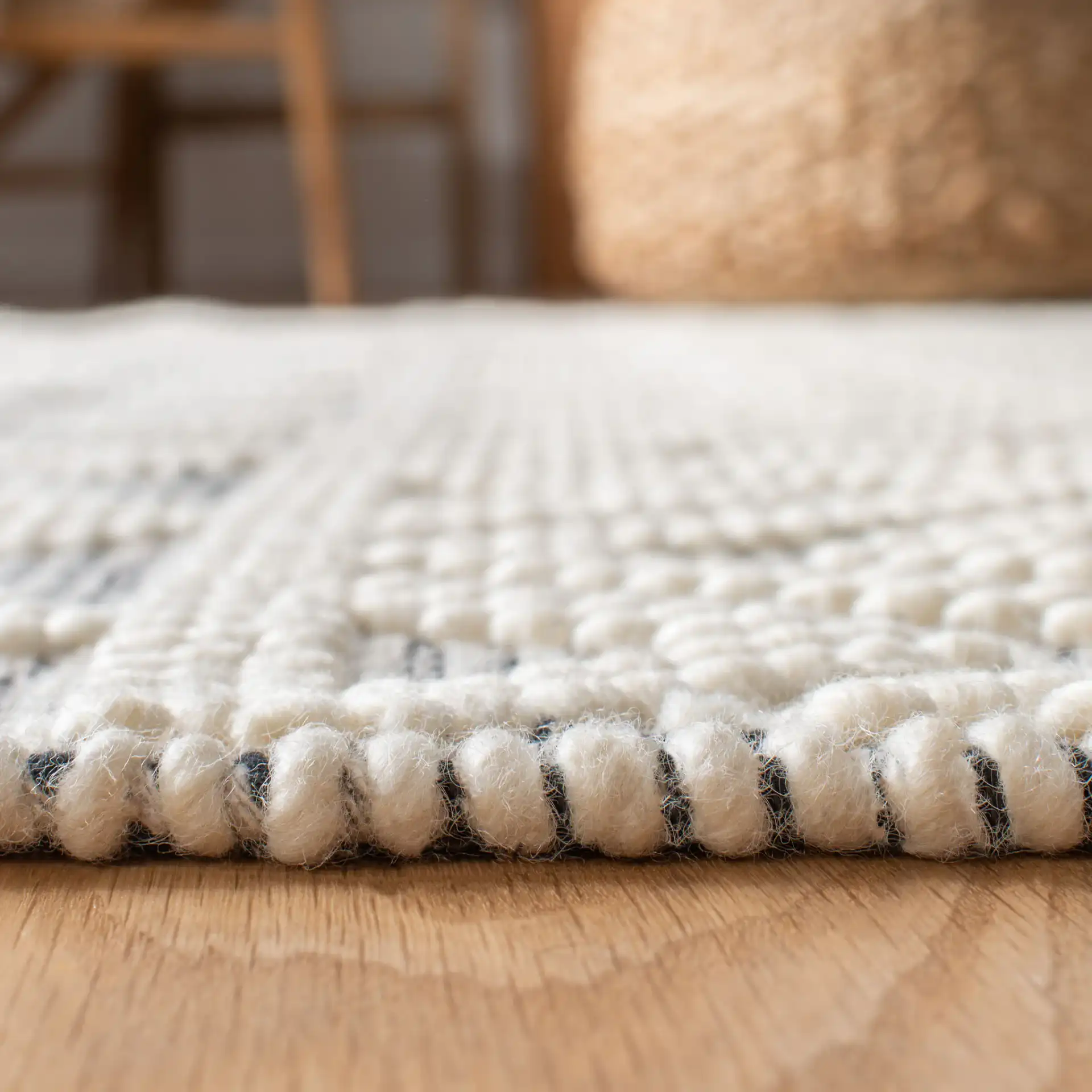 Natura Chevron And Diamond Hand-Loomed Rug in Ivory / Black in a styled room